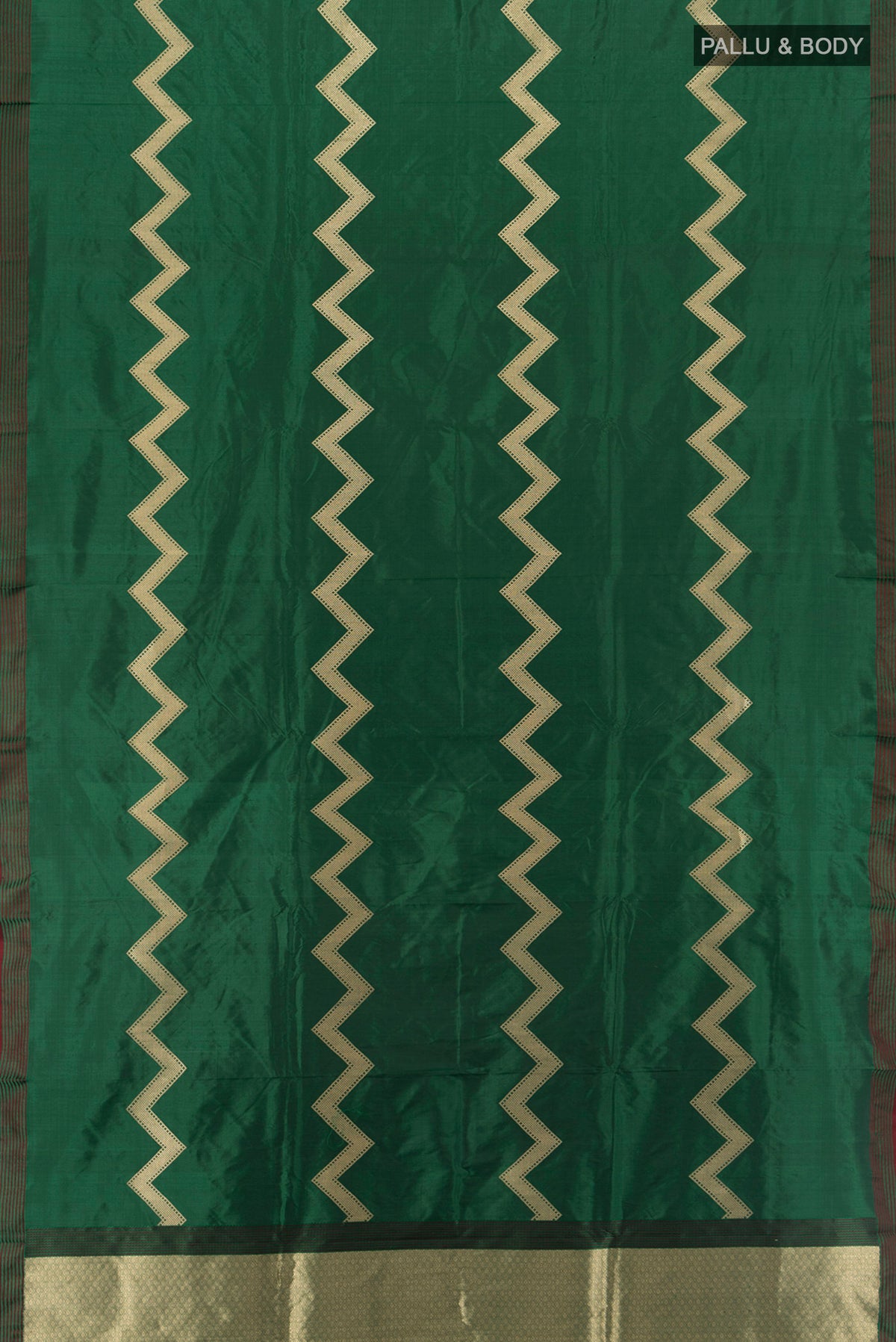 Flat view of Bottle Green Banarasi Katan Silk Saree with Zig Zag design on the body and Plain Border. 