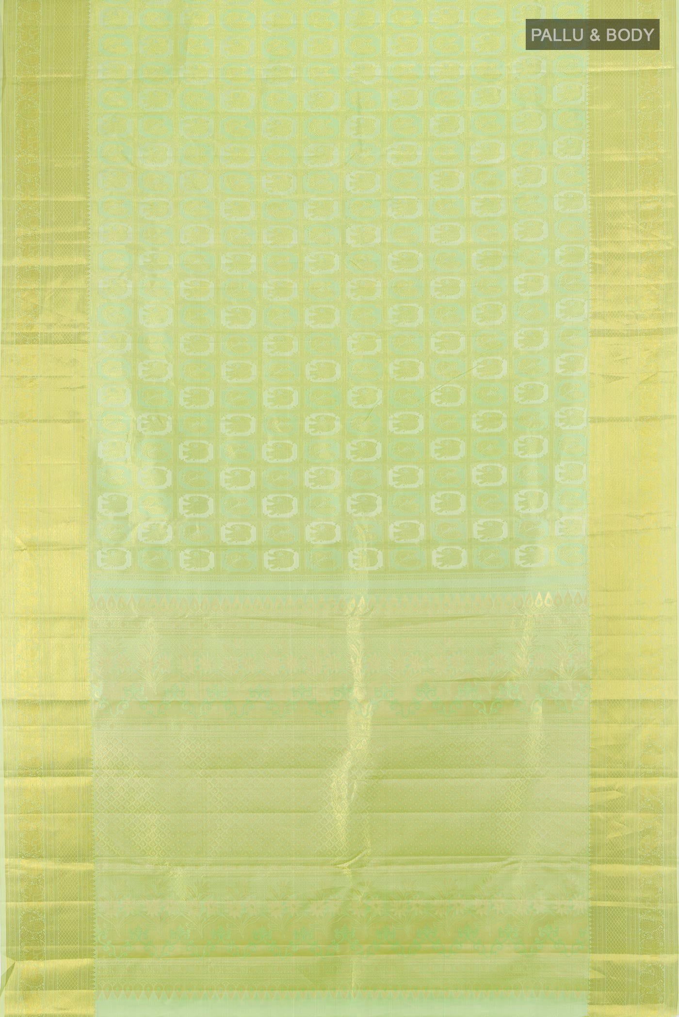 Flat view of Pista Green Kanchipuram Silk Saree with Zari Butta on the body and Zari Border. 
