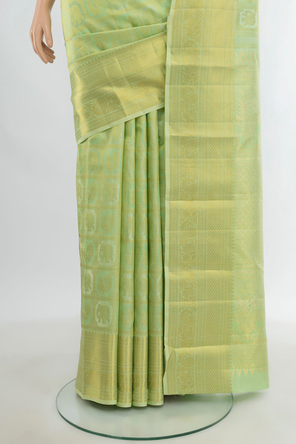 Pleats and pallu of Pista Green Kanchipuram Silk Saree with Zari Butta on the body and Zari Border. 