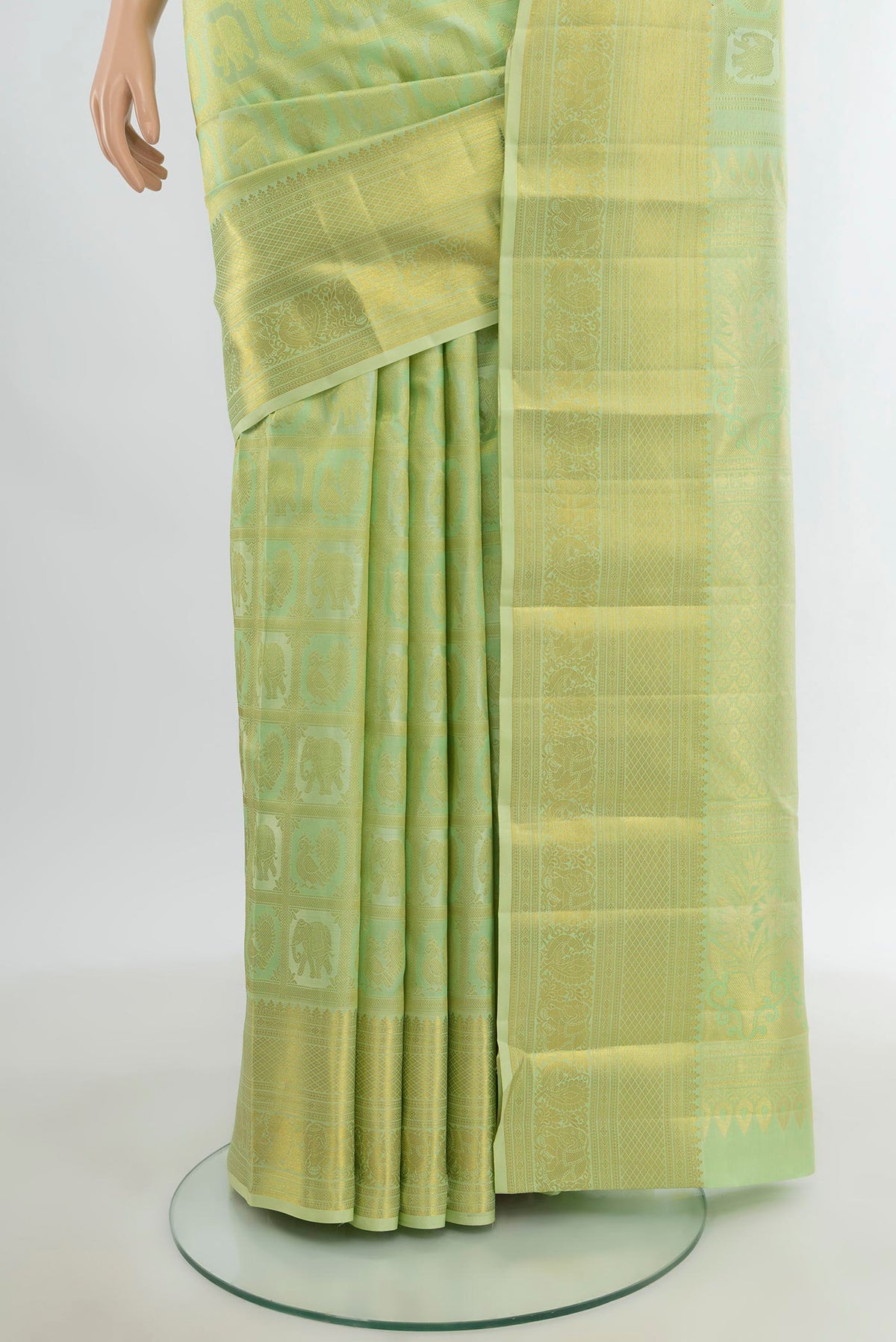 Pleats and pallu of Pista Green Kanchipuram Silk Saree with Zari Butta on the body and Zari Border. 