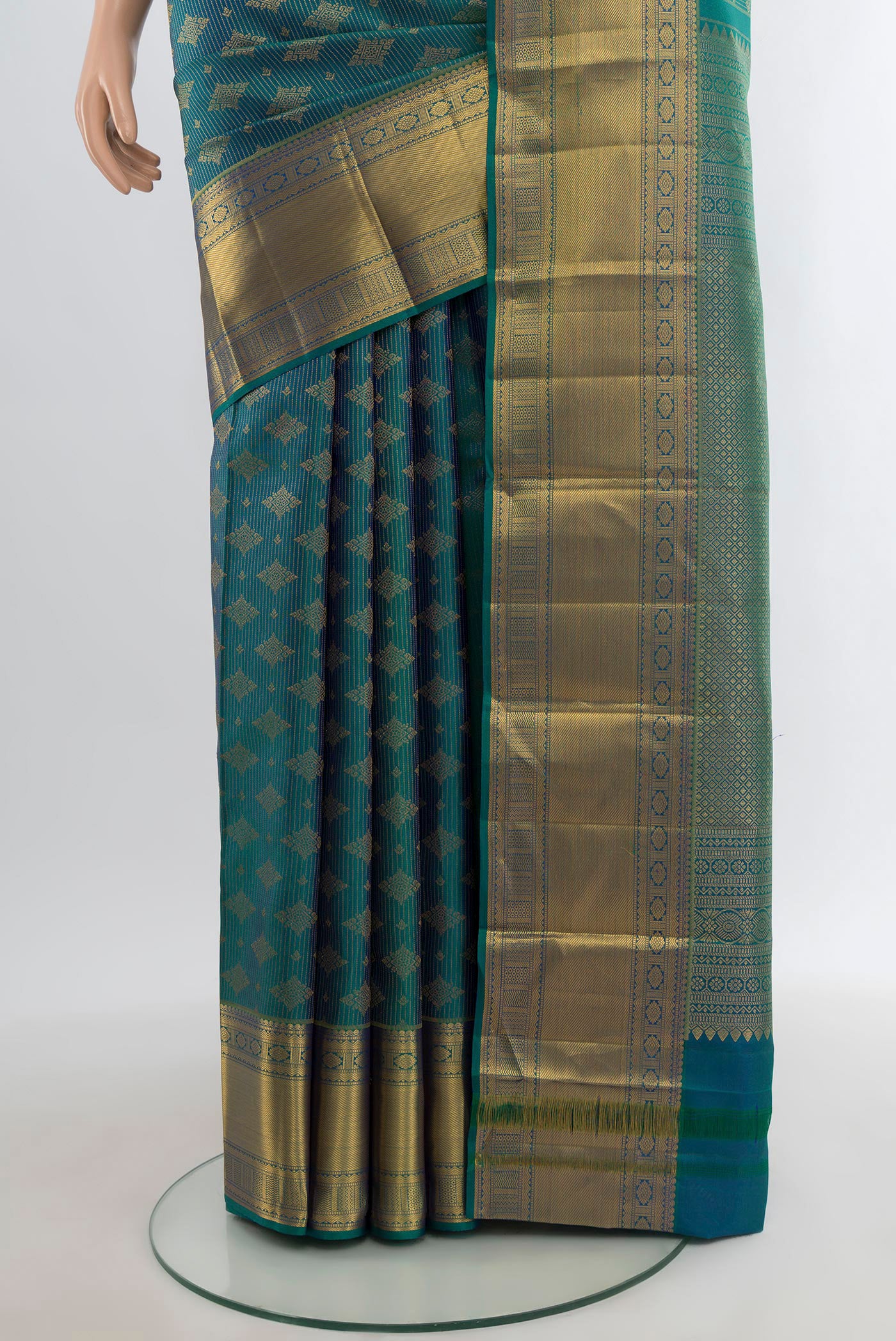 Pleats and pallu of Peacock Blue Kanchipuram Silk Saree with Zari Brocade on the body and Zari Border. 