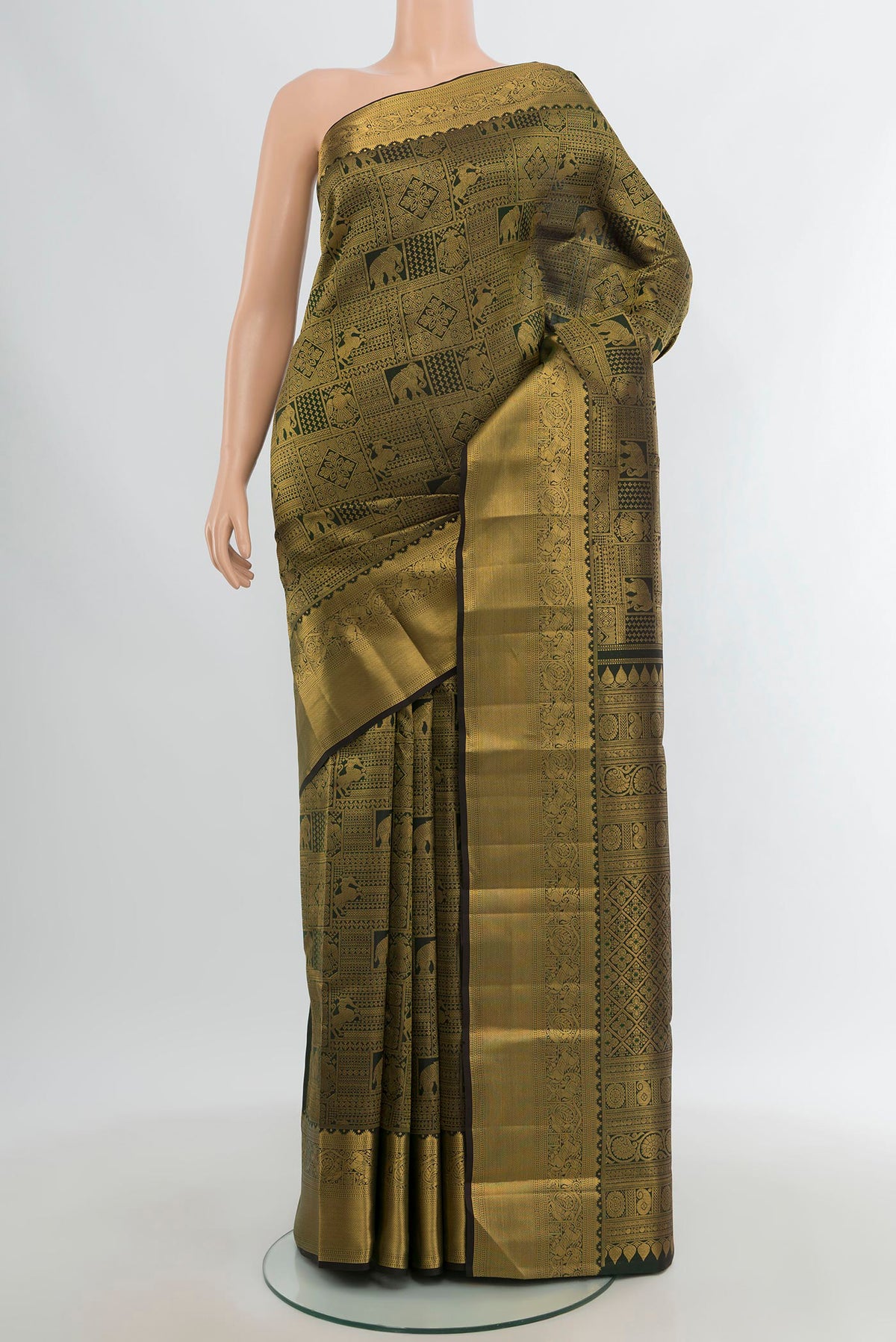 Bottle Green Kanchipuram Silk Saree with Zari Brocade on the body and Zari Border.  displayed on a mannequin