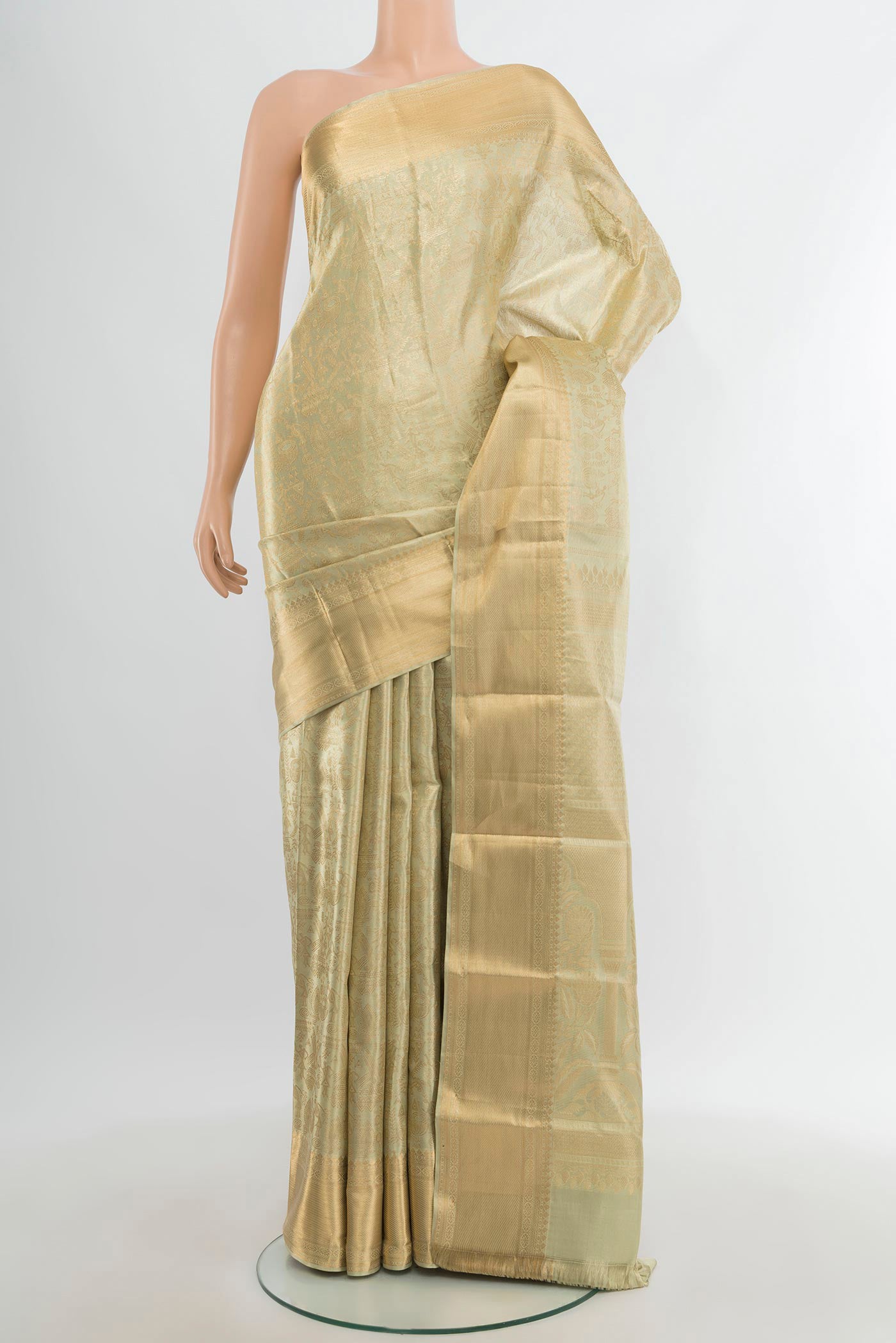 Golden Kanchipuram Tissue Silk Saree with Zari Brocade on the body and Zari Border.  displayed on a mannequin