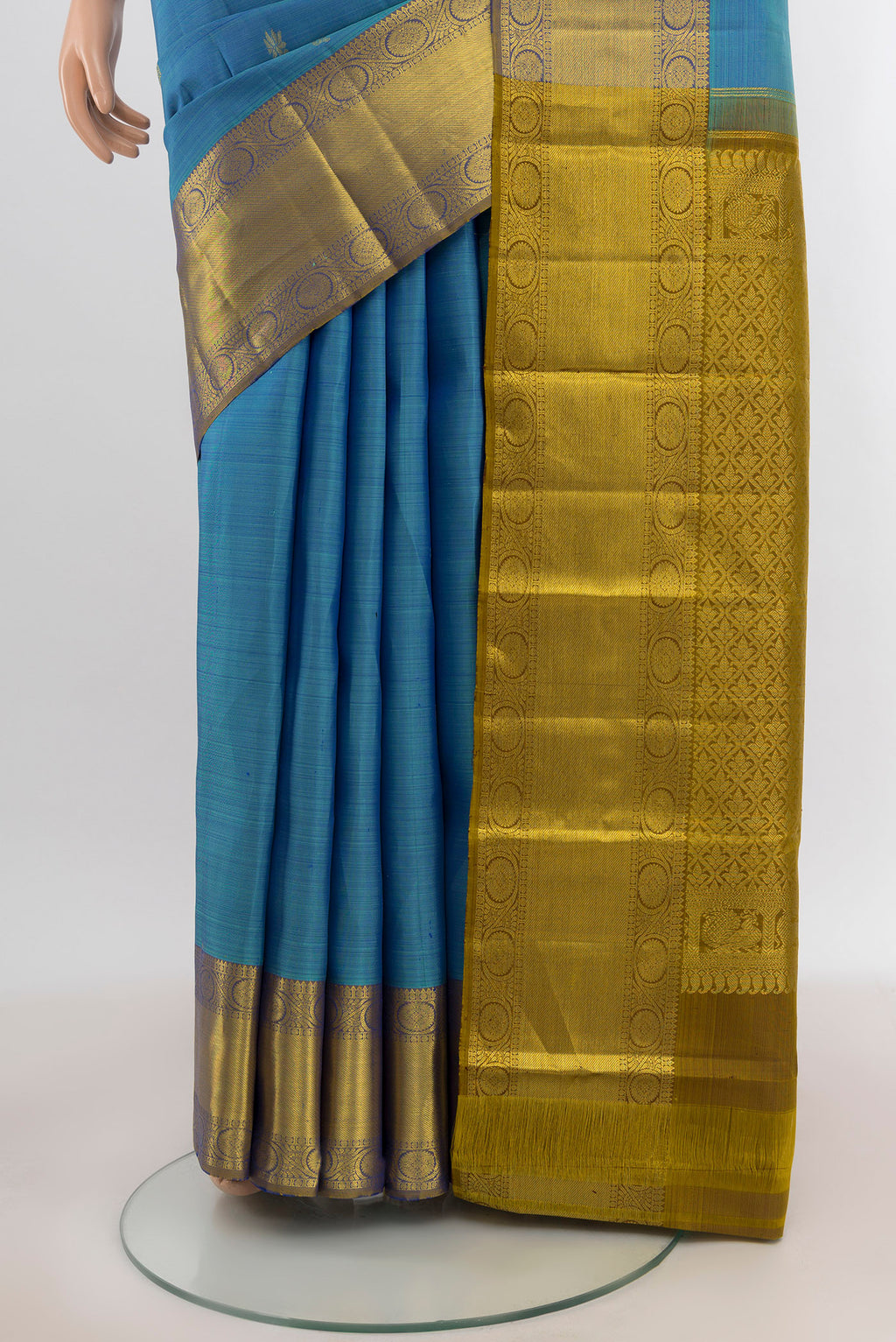 Pleats and pallu of Light Blue Kanchipuram Silk Saree with Zari Butta on the body and Zari Border. 