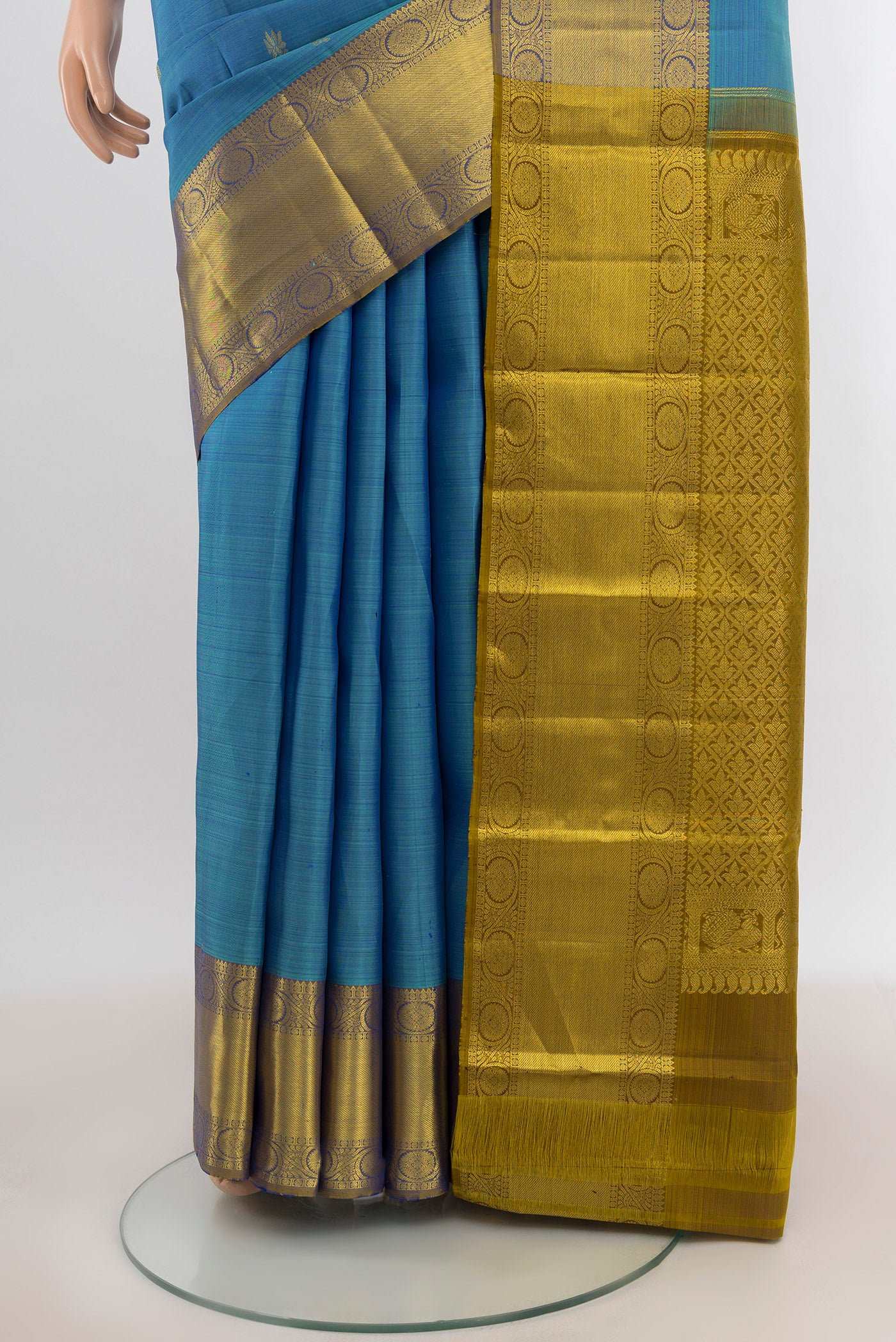 Pleats and pallu of Light Blue Kanchipuram Silk Saree with Zari Butta on the body and Zari Border. 