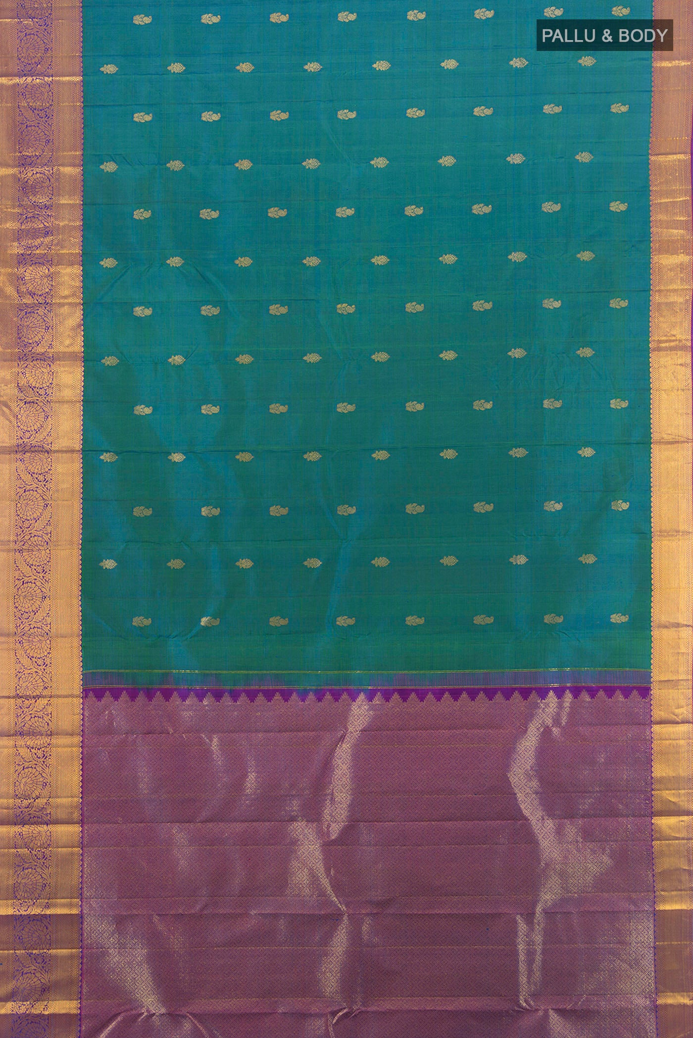 Flat view of Peacock Blue Kanchipuram Silk Saree with Zari Butta on the body and Zari Border. 