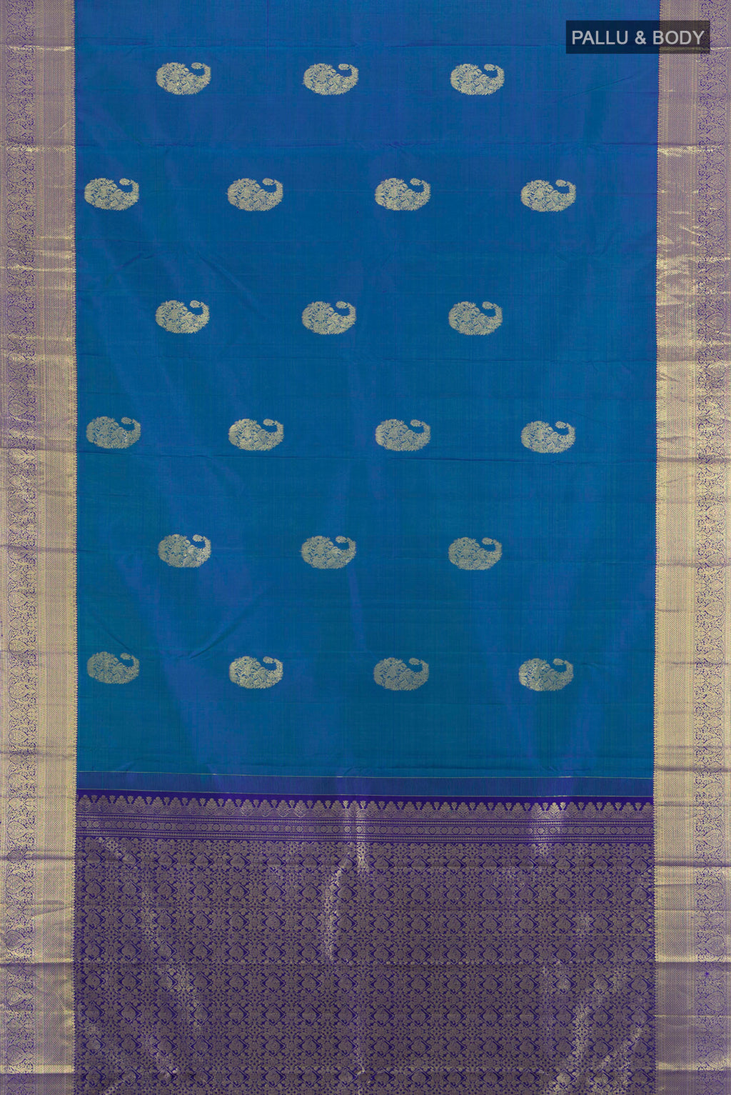 Flat view of Peacock Blue Kanchipuram Silk Saree with Zari Butta on the body and Zari Border. 