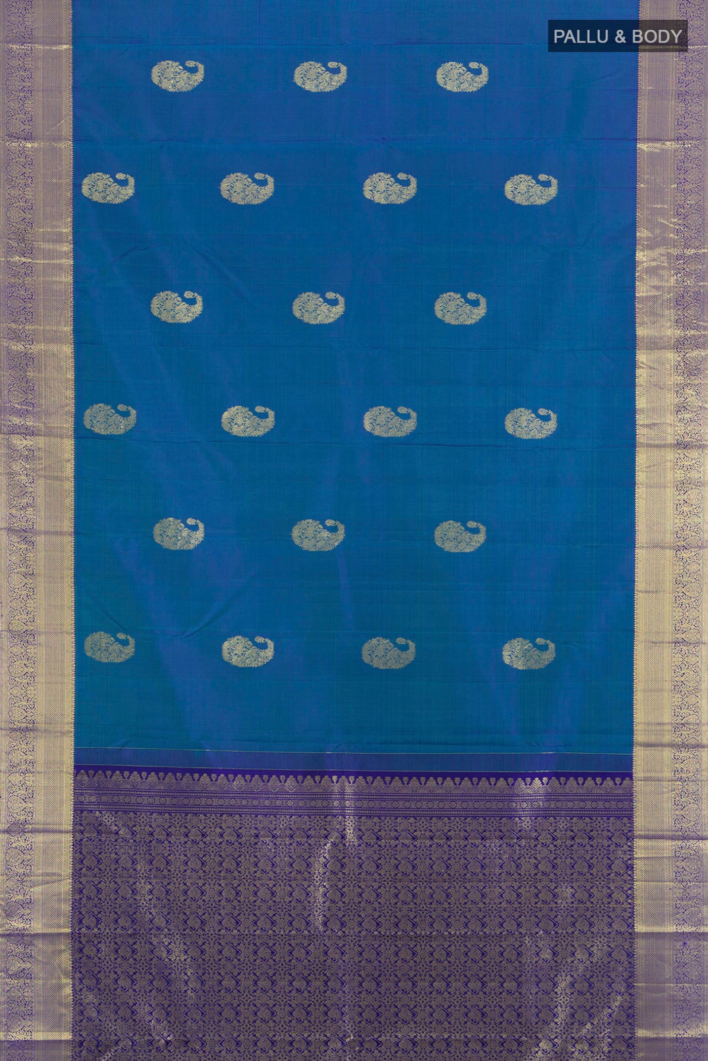 Flat view of Peacock Blue Kanchipuram Silk Saree with Zari Butta on the body and Zari Border. 