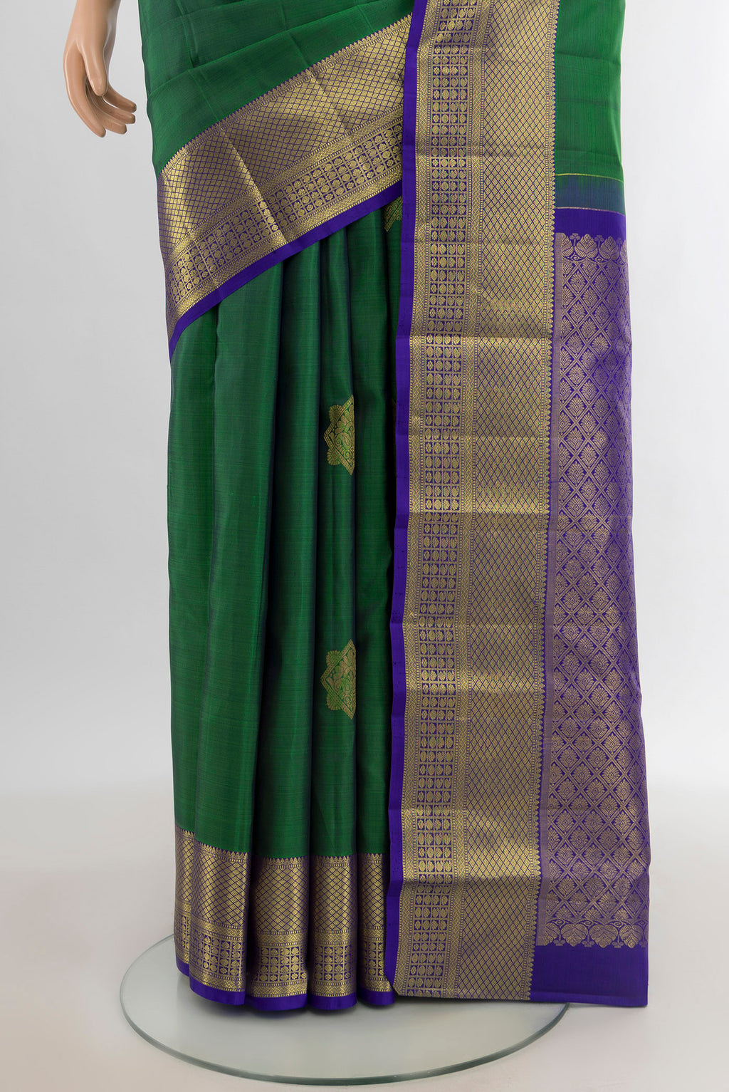 Pleats and pallu of Green Kanchipuram Silk Saree with Zari Butta on the body and Zari Border. 