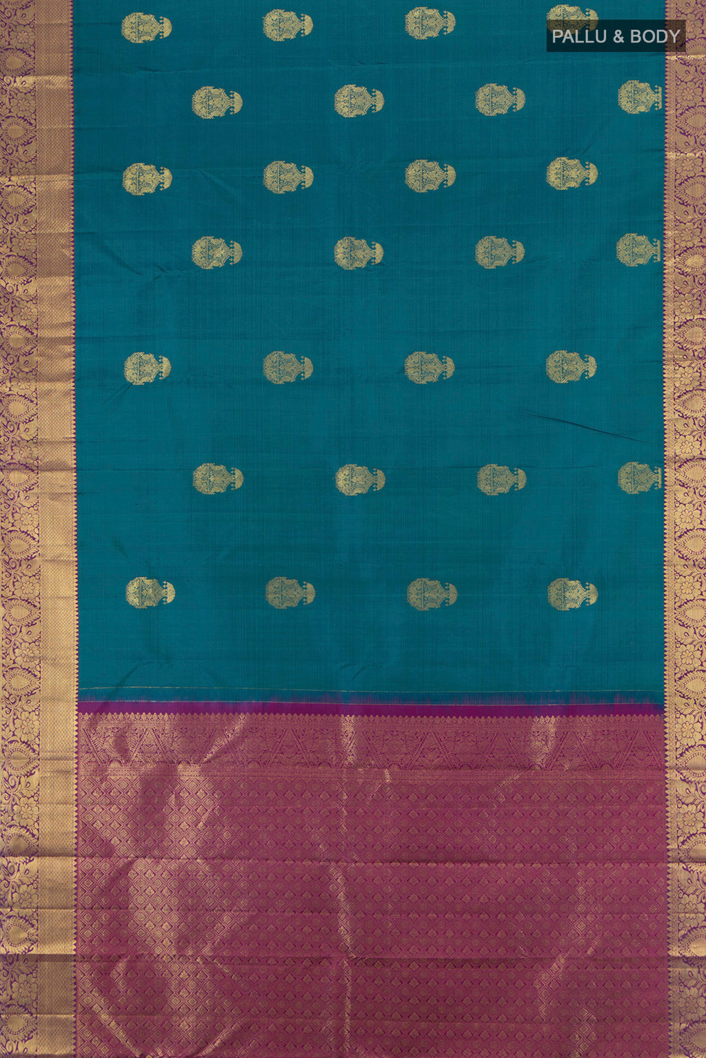Flat view of Peacock Blue Kanchipuram Silk Saree with Zari Butta on the body and Zari Border. 