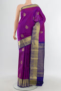 Purple Kanchipuram Silk Saree with Zari Butta on the body and Zari Border.  displayed on a mannequin