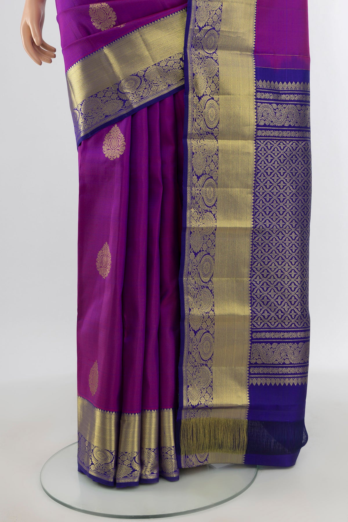 Pleats and pallu of Purple Kanchipuram Silk Saree with Zari Butta on the body and Zari Border. 