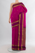 Pure Silk Pink Kanchipuram Saree with Zari Butta on the body and Zari Border.  displayed on a mannequin