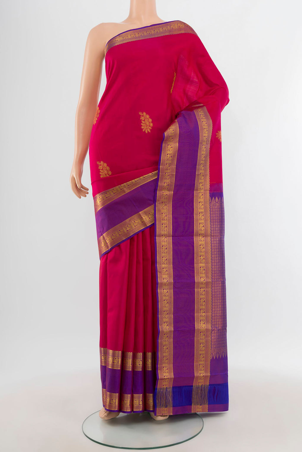 Dark Pink Kanchipuram Silk Saree with Zari Butta on the body and Zari Border.  displayed on a mannequin