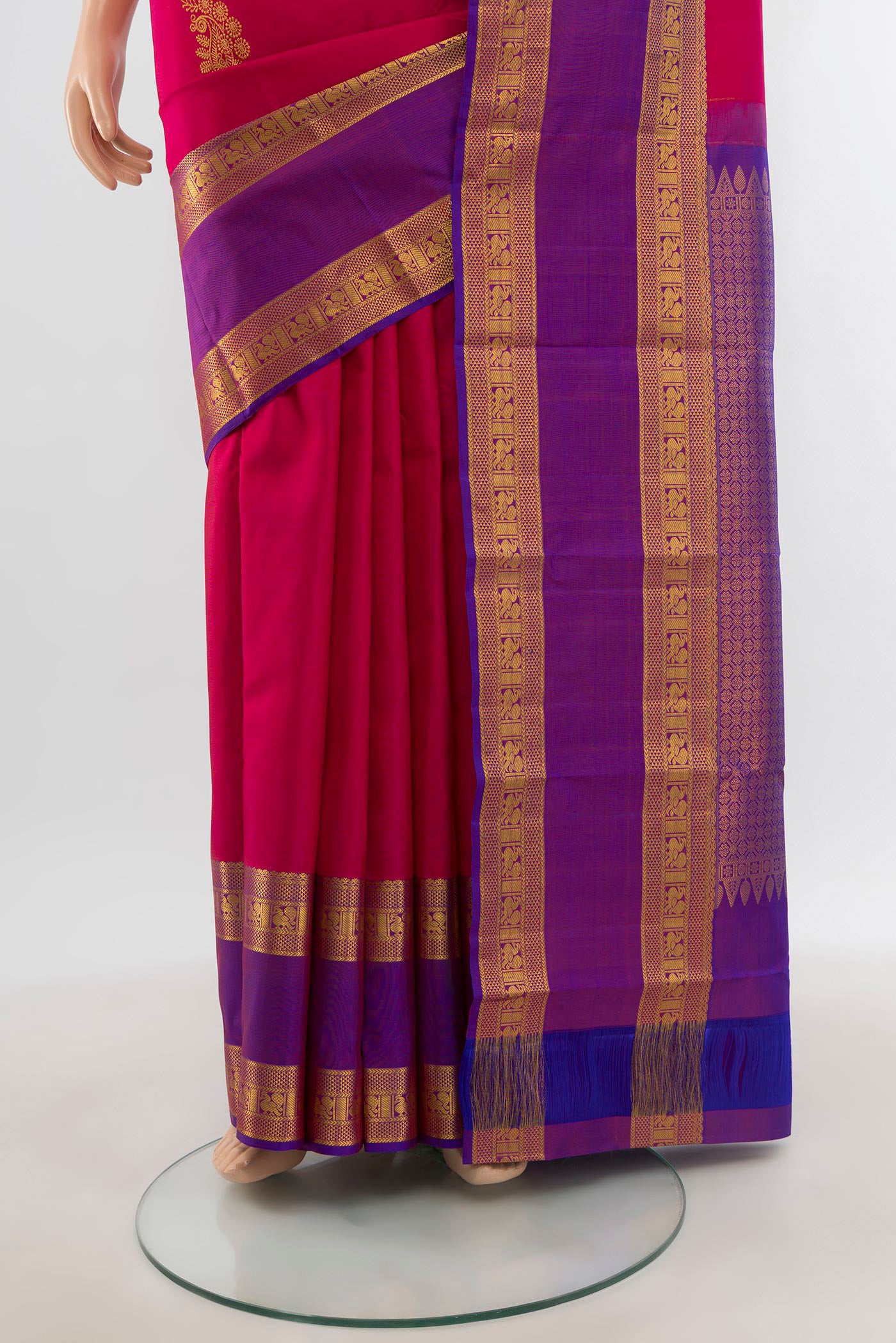 Pleats and pallu of Dark Pink Kanchipuram Silk Saree with Zari Butta on the body and Zari Border. 