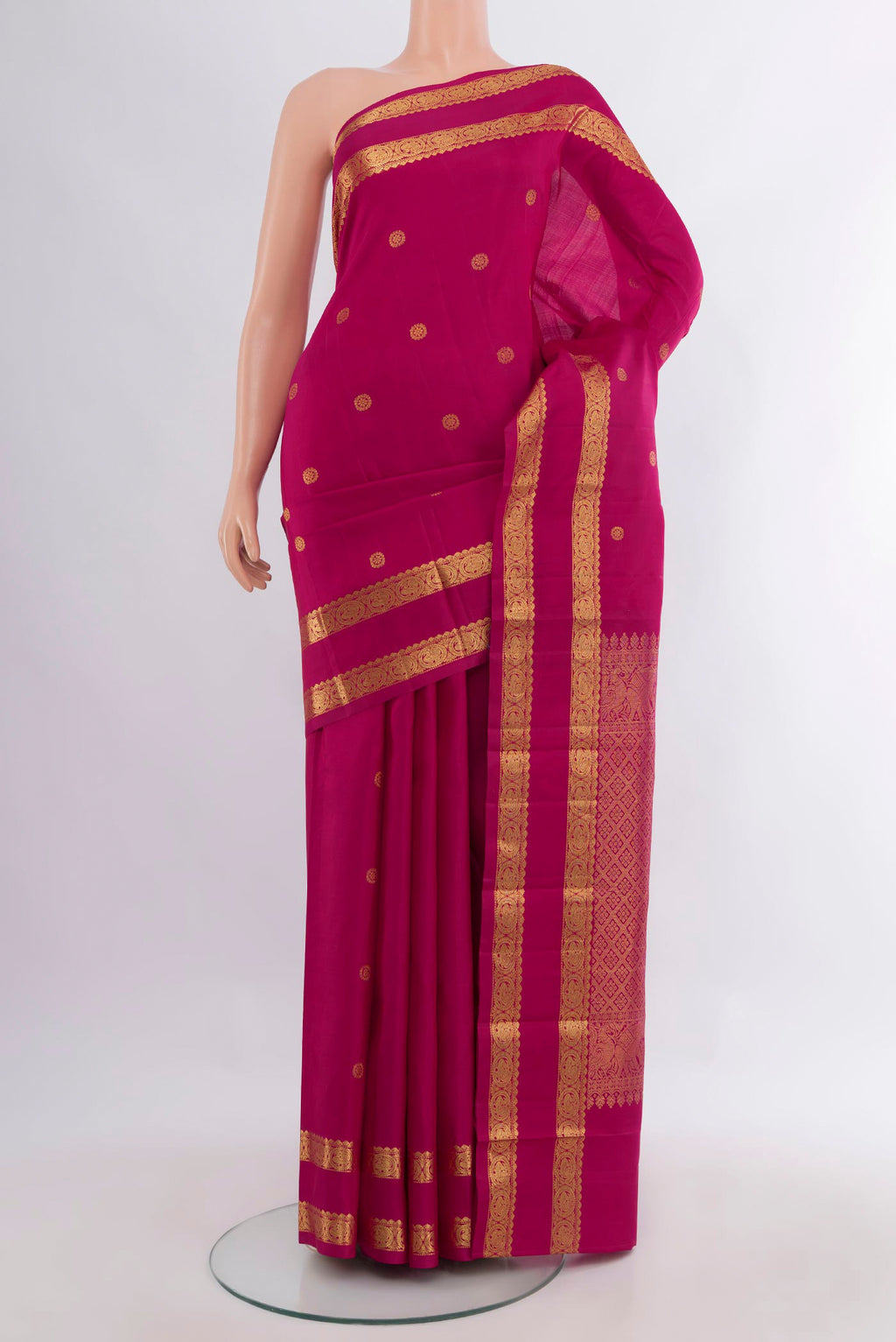 Pure Silk Magenta Kanchipuram Saree with Zari Butta on the body and Zari Border.  displayed on a mannequin