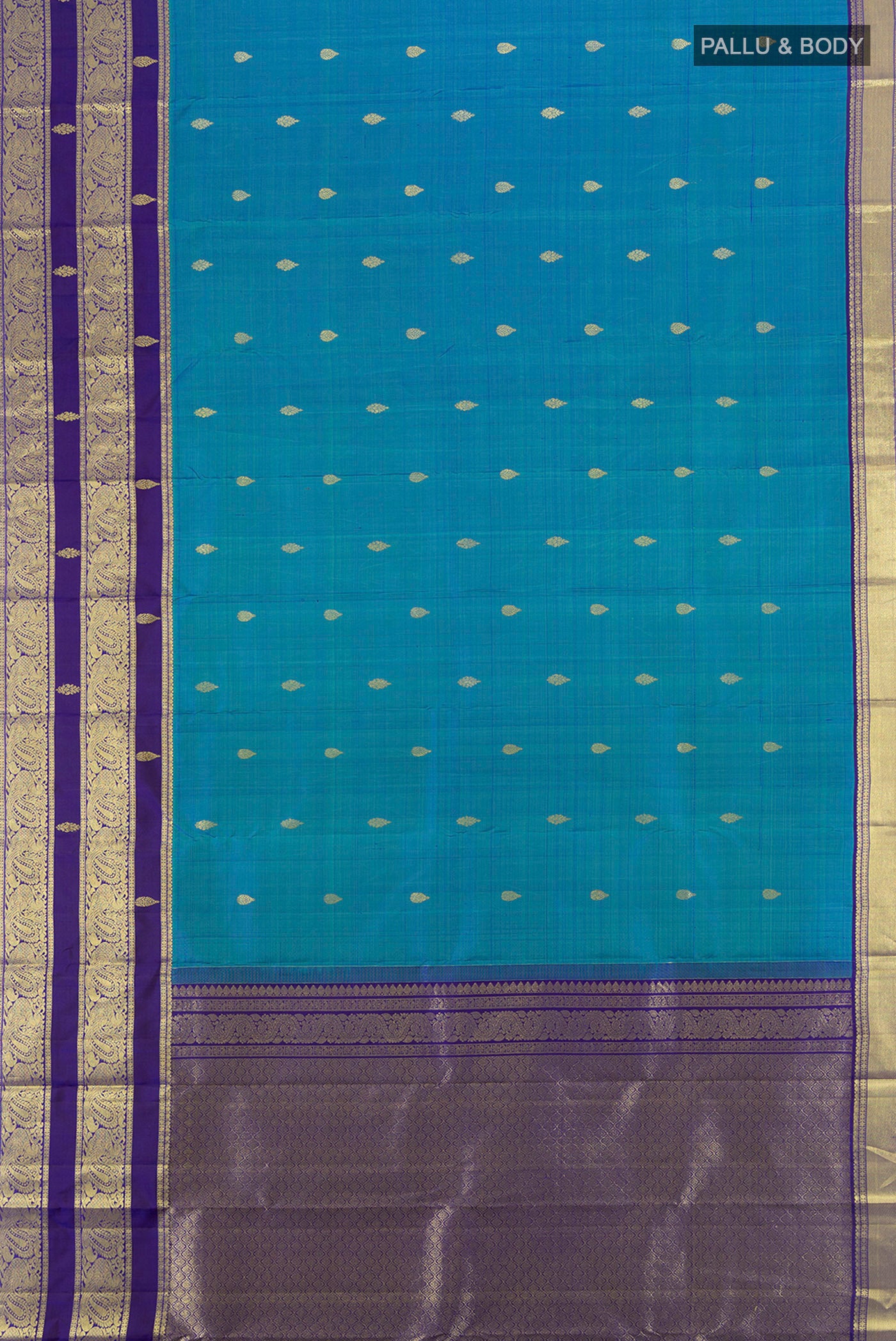 Flat view of Peacock Blue Kanchipuram Silk Saree with Zari Butta on the body and Silk Border. 