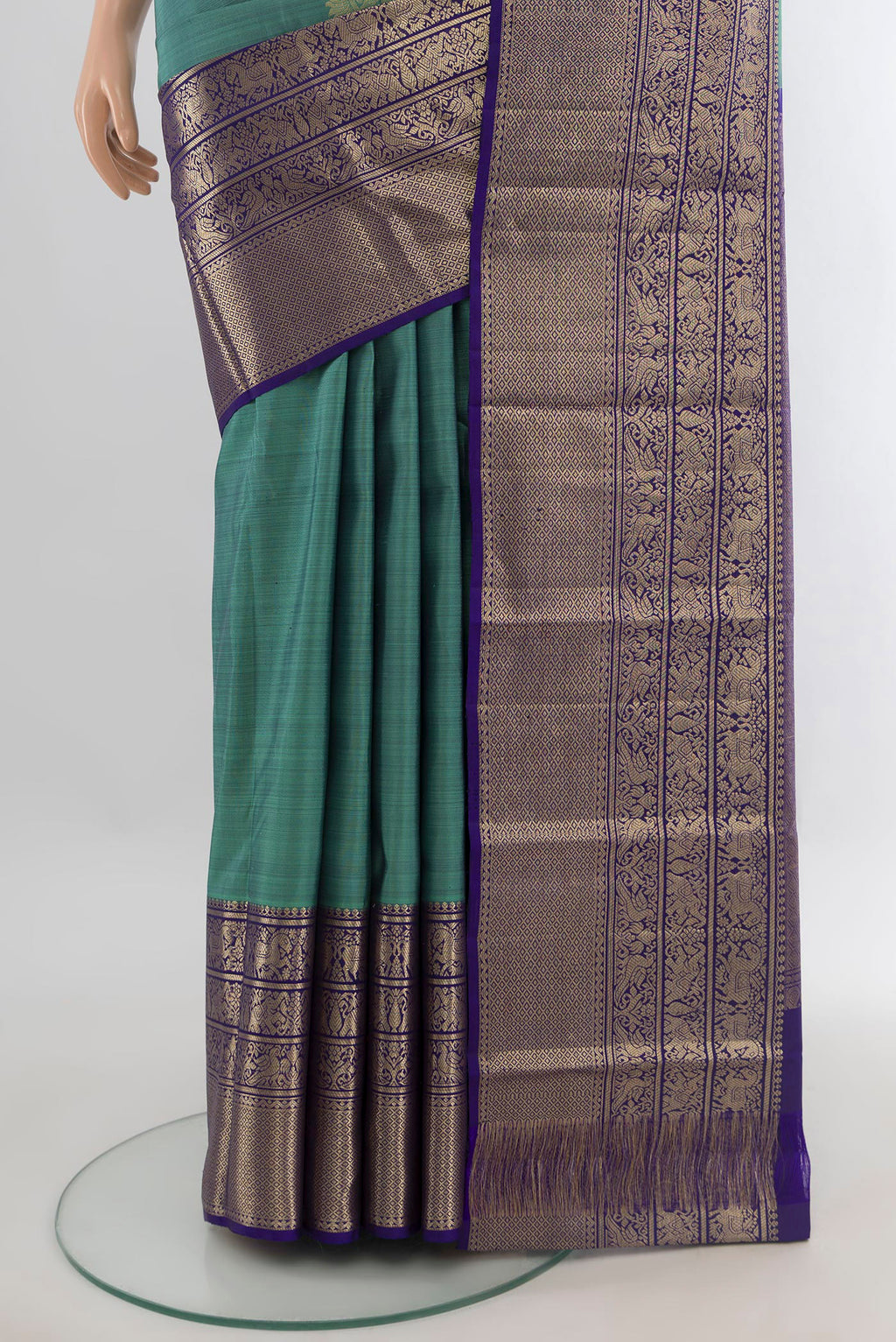 Pleats and pallu of Pure Silk Sea Green Kanchipuram Saree with Zari Butta on the body and Zari Border. 