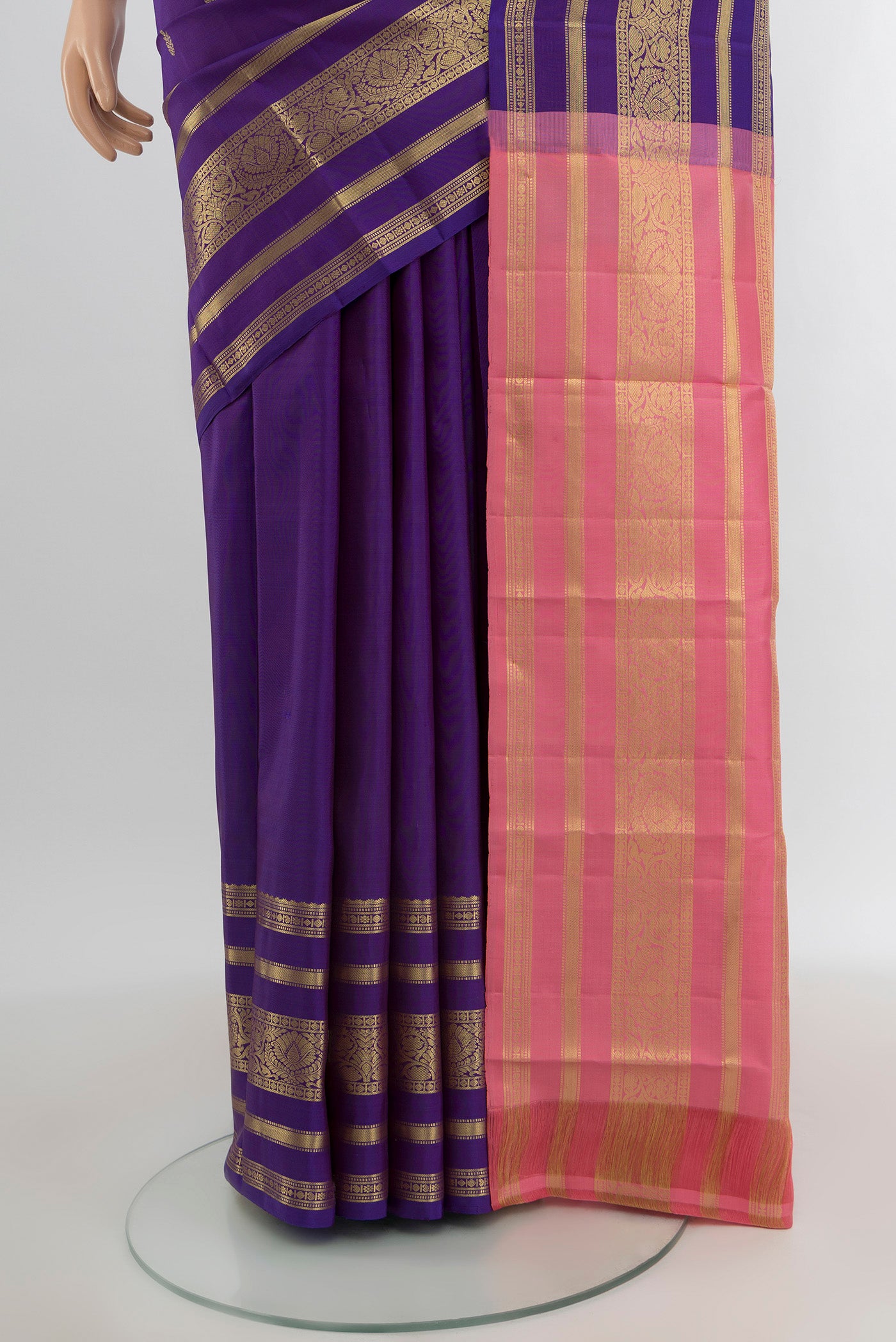 Pleats and pallu of Violet Kanchipuram Silk Saree with Zari Butta on the body and Zari Border. 