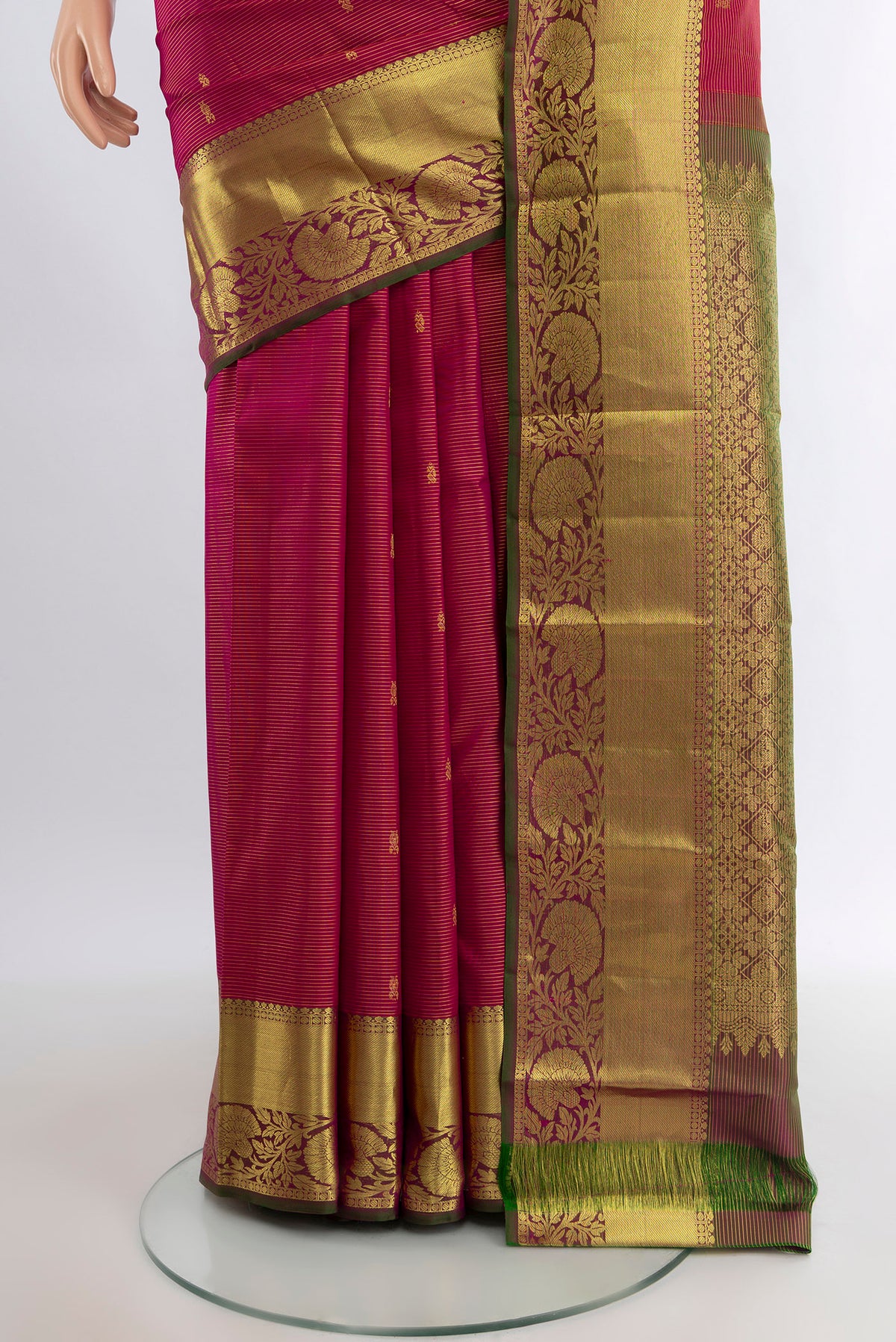 Pleats and pallu of Pink Kanchipuram Silk Saree with Zari Butta on the body and Zari Border. 