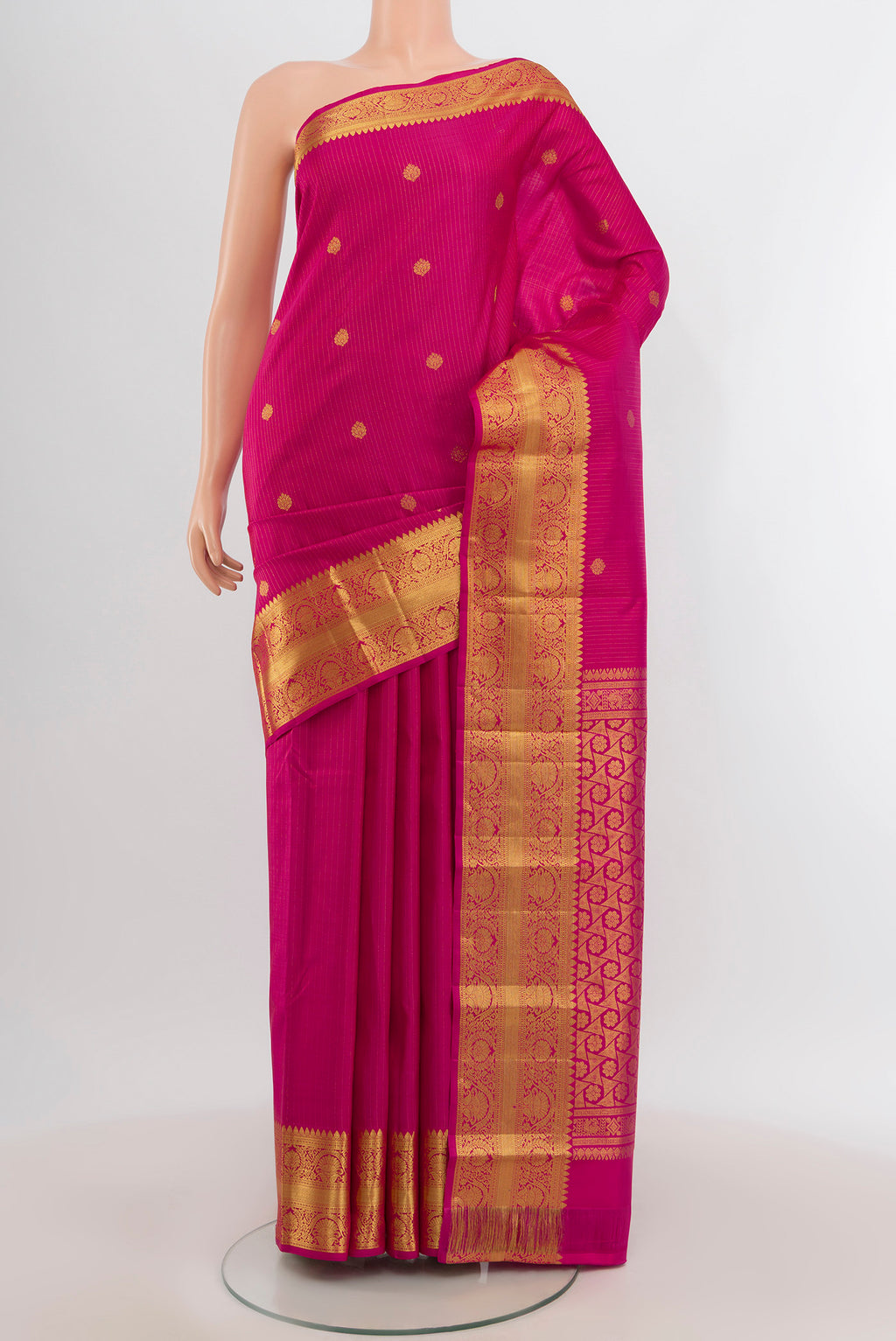 Dark Pink Kanchipuram Silk Saree with Zari Butta on the body and Zari Border.  displayed on a mannequin