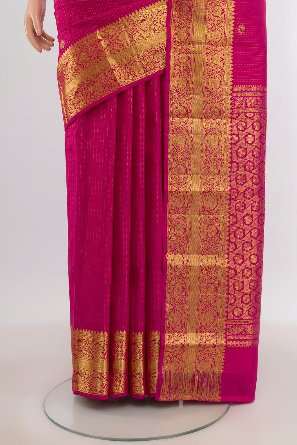 Pleats and pallu of Dark Pink Kanchipuram Silk Saree with Zari Butta on the body and Zari Border. 