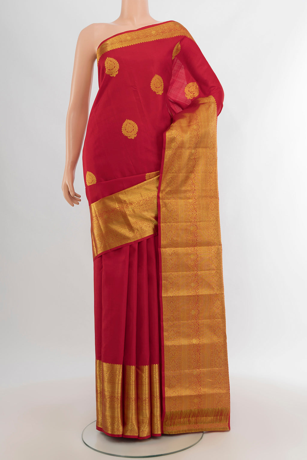 Red Kanchipuram Silk Saree with Zari Butta on the body and Zari Border.  displayed on a mannequin