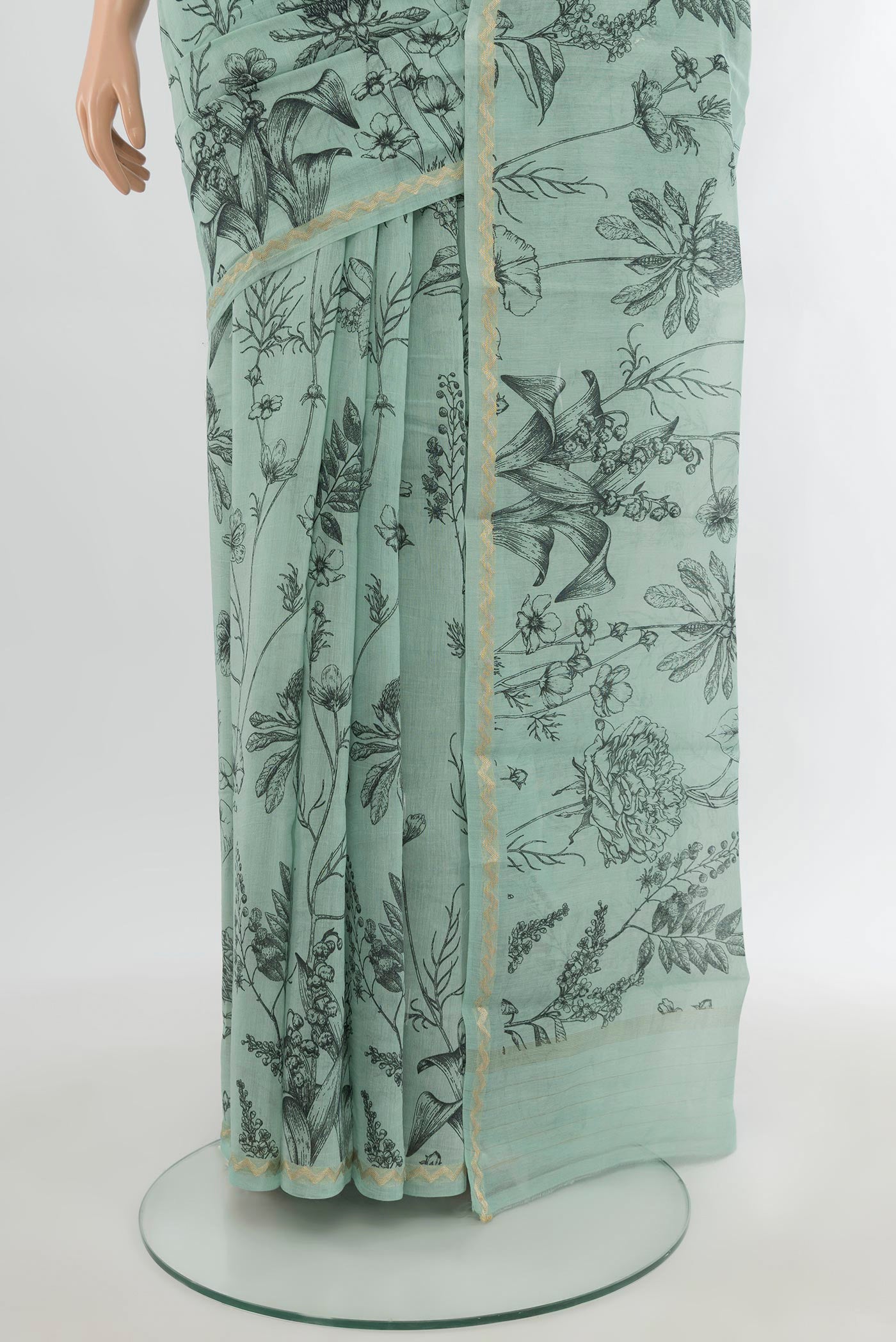 Pleats and pallu of Light Blue Maheshwari Silk Cotton Saree with Floral Print on the body and Zari Border. 