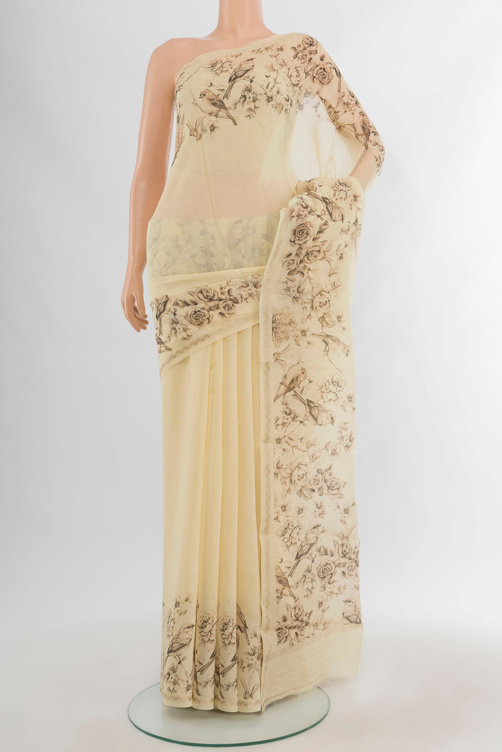 Cream Maheshwari Silk Cotton Saree with Plain Body and Printed Border.  displayed on a mannequin