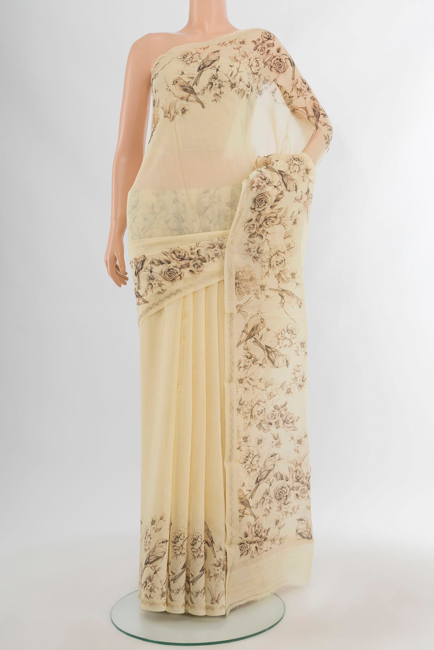 Cream Maheshwari Silk Cotton Saree with Plain Body and Printed Border.  displayed on a mannequin