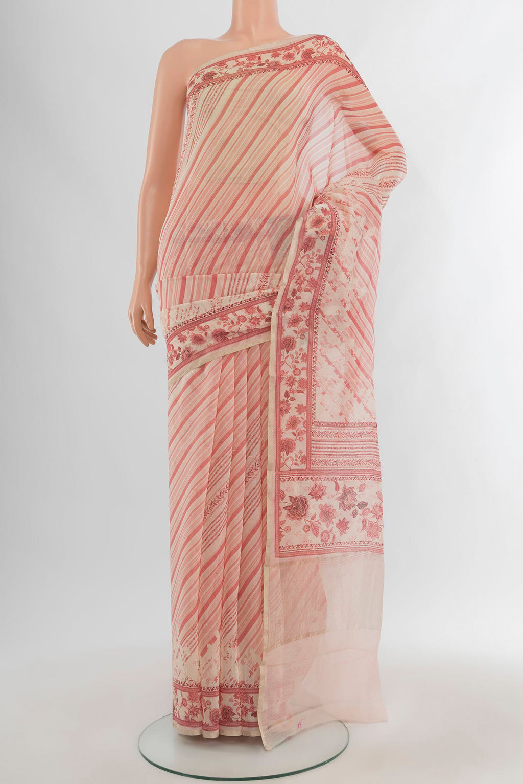 Cream Tussar Silk Saree with Floral Print on the body and Plain Border.  displayed on a mannequin