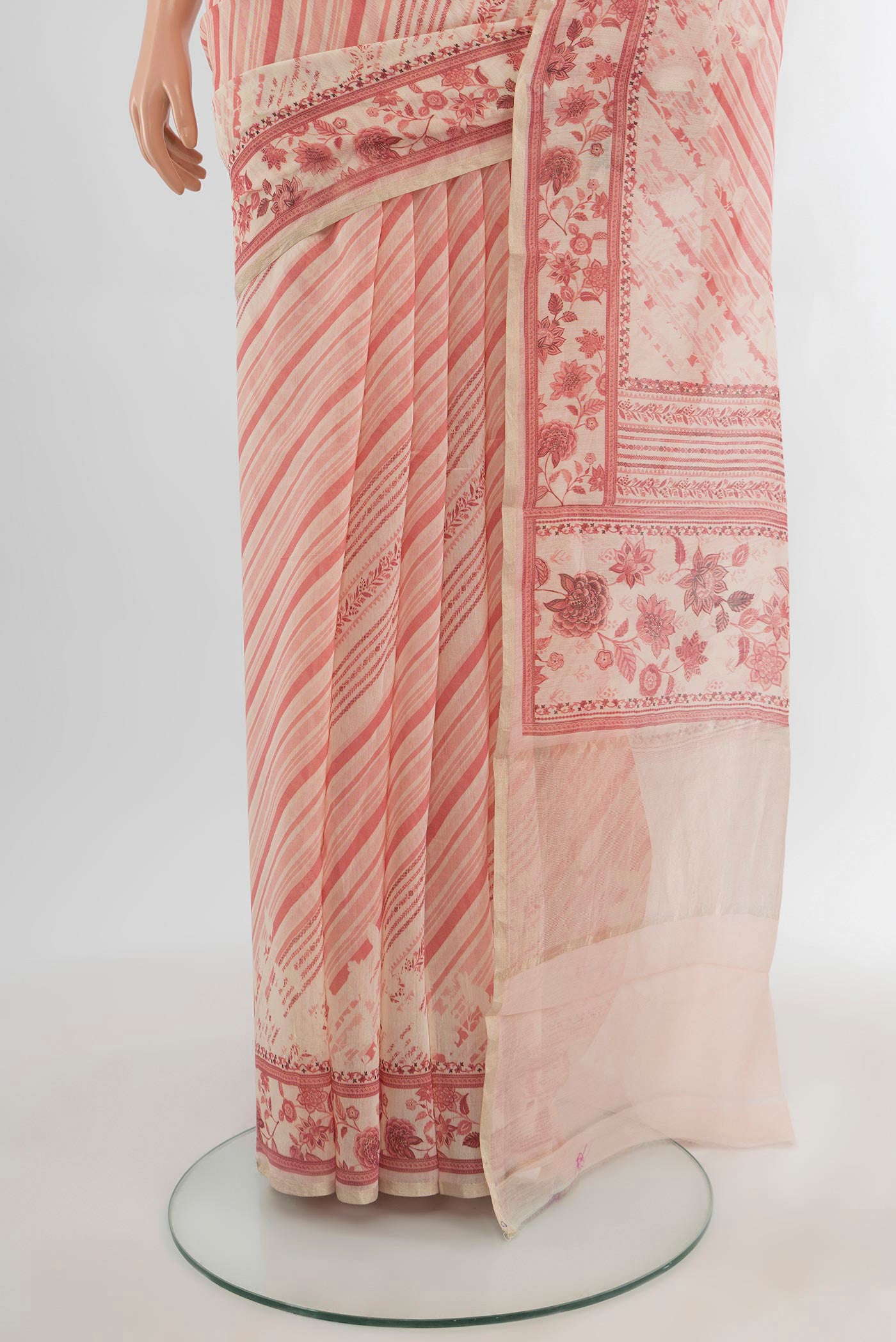 Pleats and pallu of Cream Tussar Silk Saree with Floral Print on the body and Plain Border. 