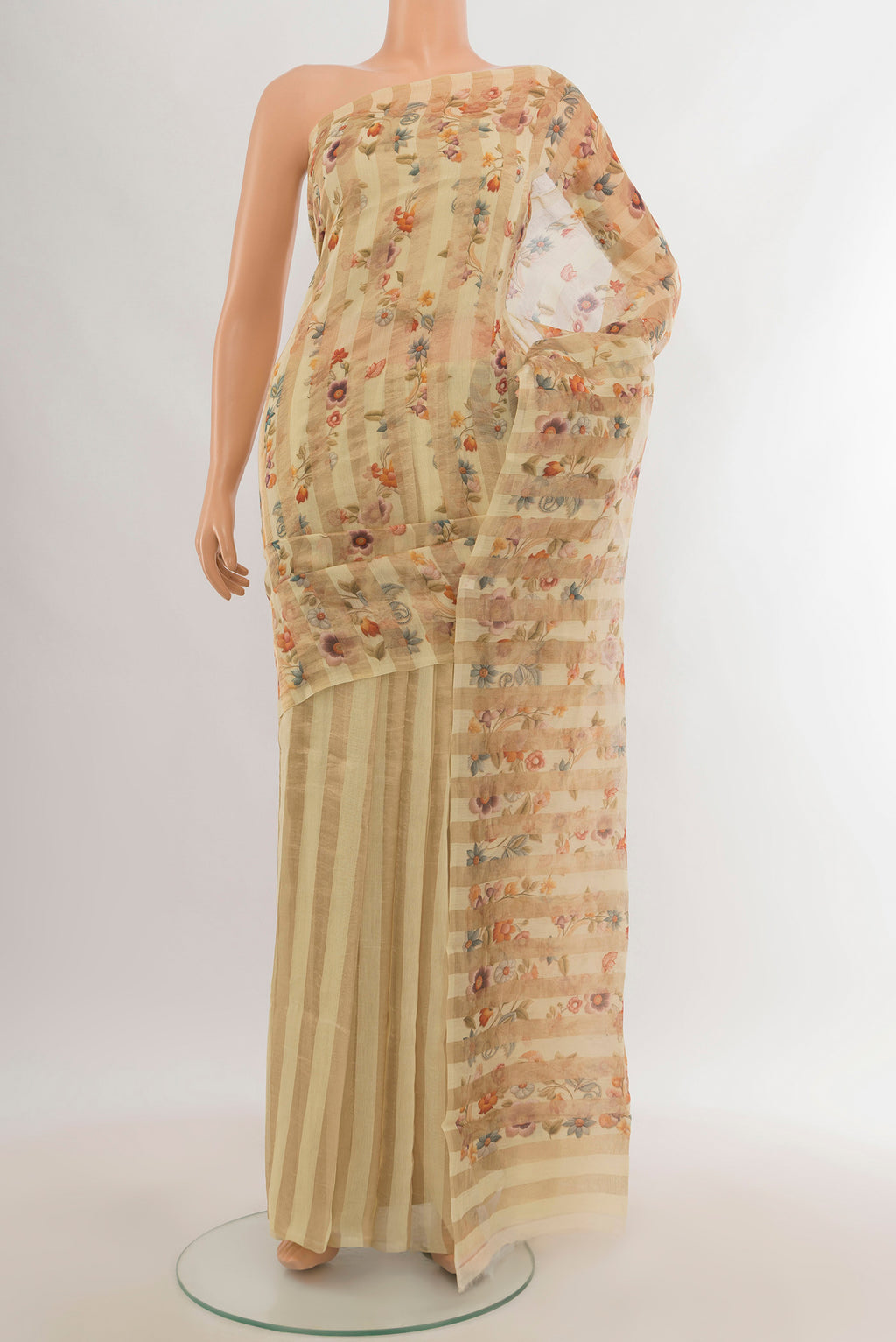 Cream Maheshwari Silk Cotton Saree with Floral Print on the body and Without Border.  displayed on a mannequin