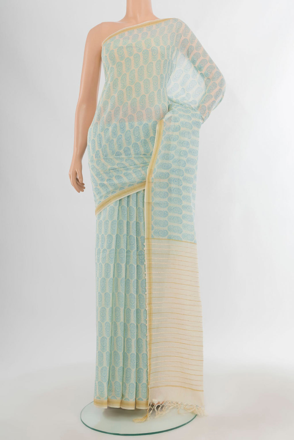 Cream Tussar Silk Saree with Floral Print on the body and Plain Border.  displayed on a mannequin