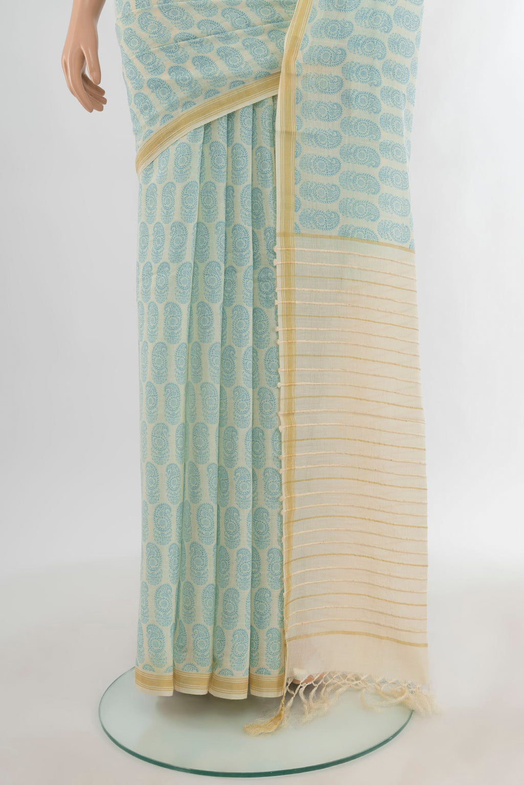 Pleats and pallu of Cream Tussar Silk Saree with Floral Print on the body and Plain Border. 