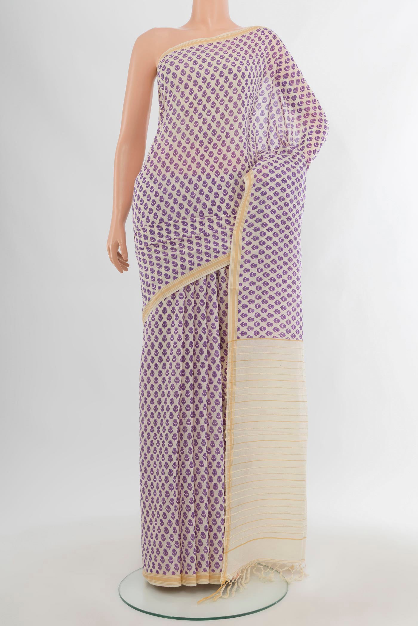 Cream Tussar Silk Saree with Floral Print on the body and Plain Border.  displayed on a mannequin