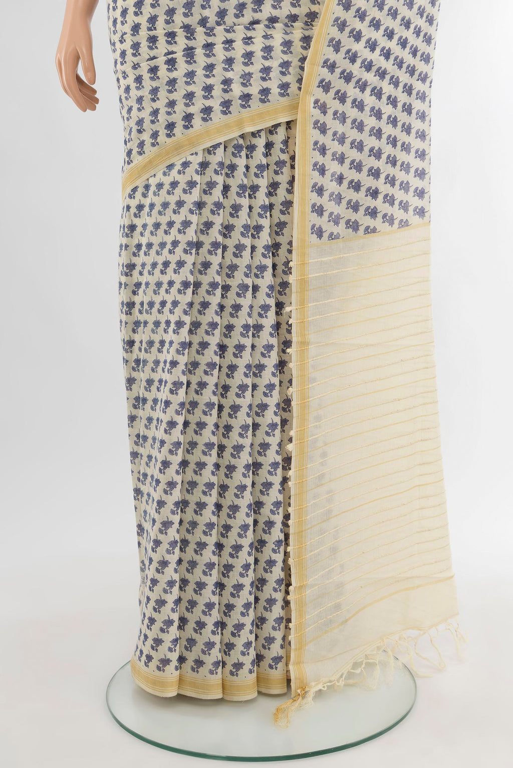 Pleats and pallu of Cream Tussar Silk Saree with Floral Print on the body and Plain Border. 