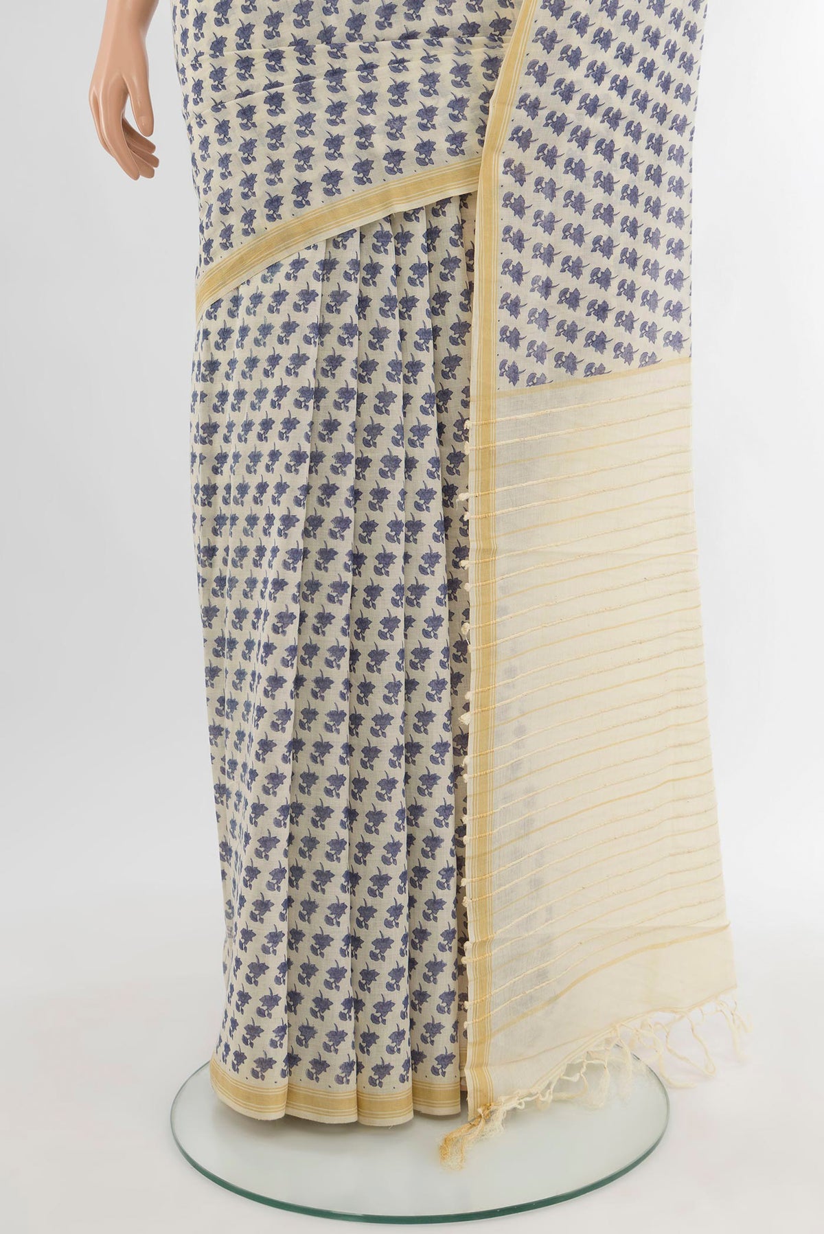 Pleats and pallu of Cream Tussar Silk Saree with Floral Print on the body and Plain Border. 