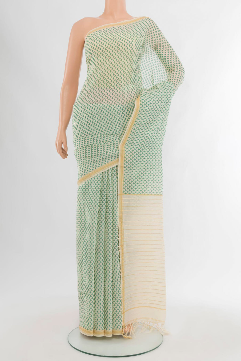 Cream Tussar Silk Saree with Floral Print on the body and Plain Border.  displayed on a mannequin