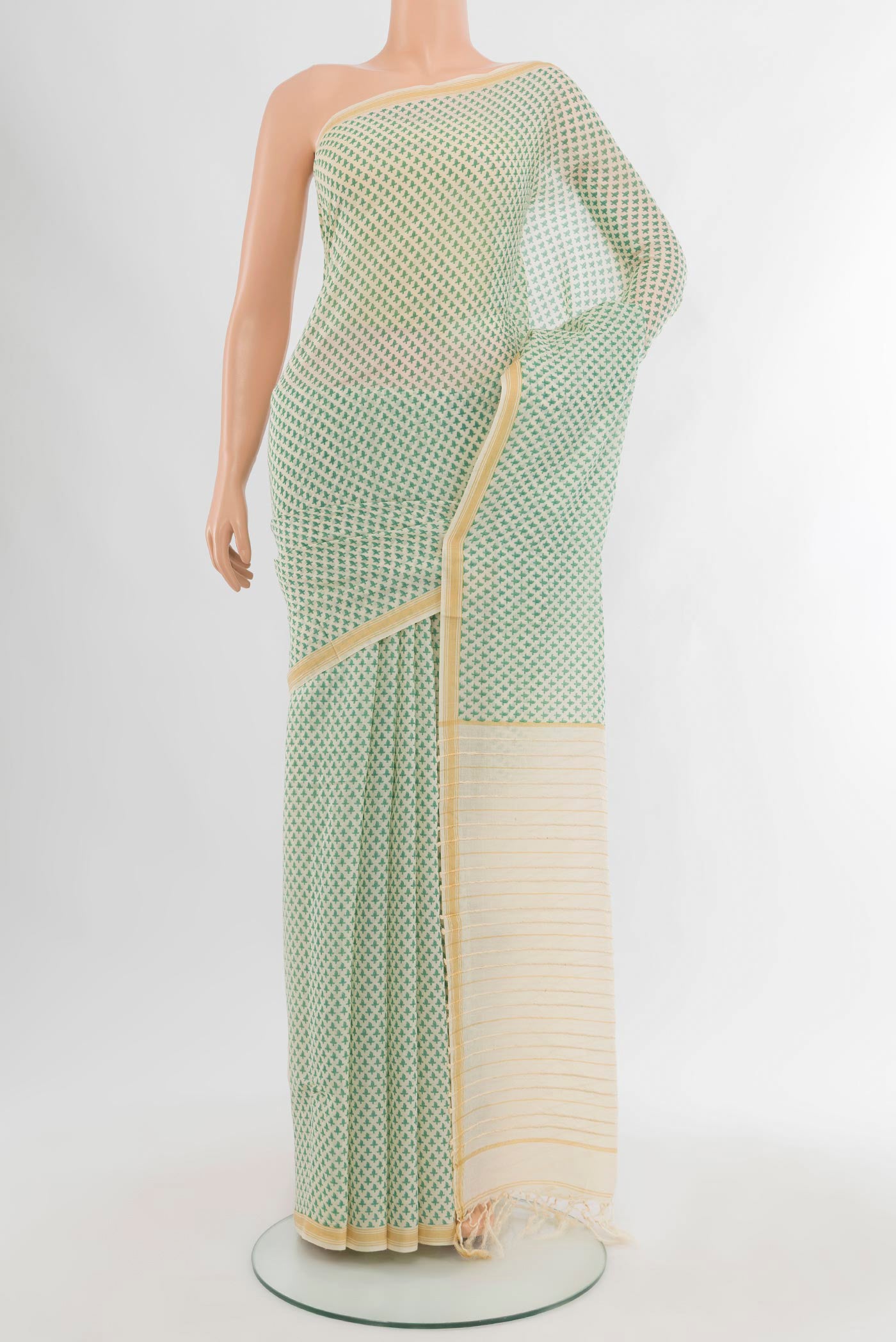 Cream Tussar Silk Saree with Floral Print on the body and Plain Border.  displayed on a mannequin