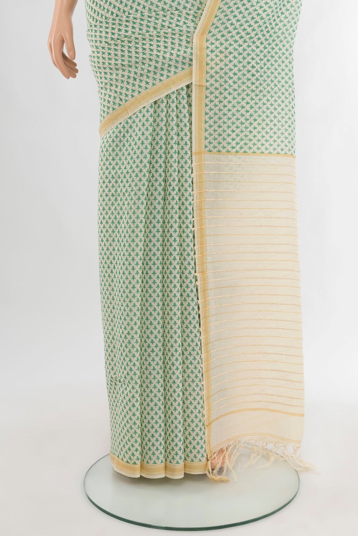 Pleats and pallu of Cream Tussar Silk Saree with Floral Print on the body and Plain Border. 