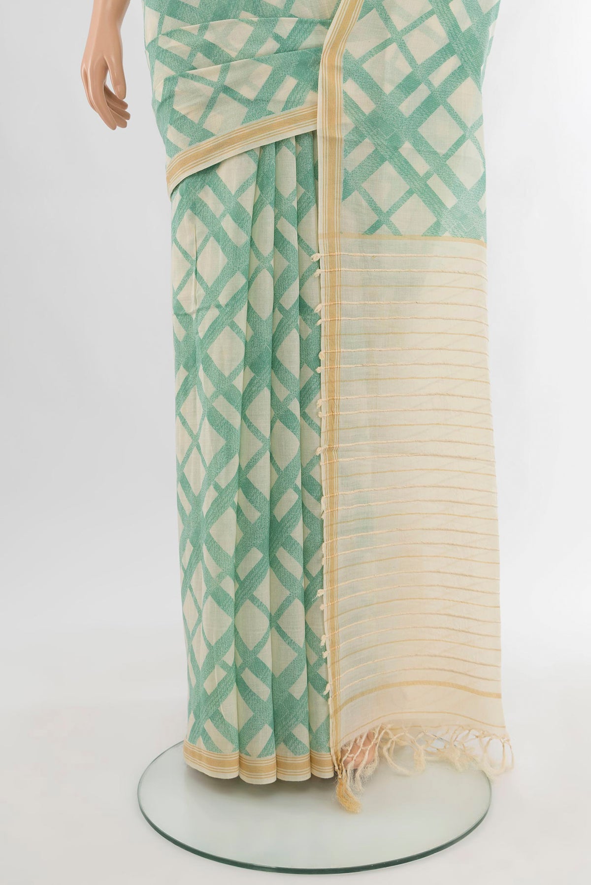 Pleats and pallu of Cream Tussar Silk Saree with Floral Print on the body and Plain Border. 