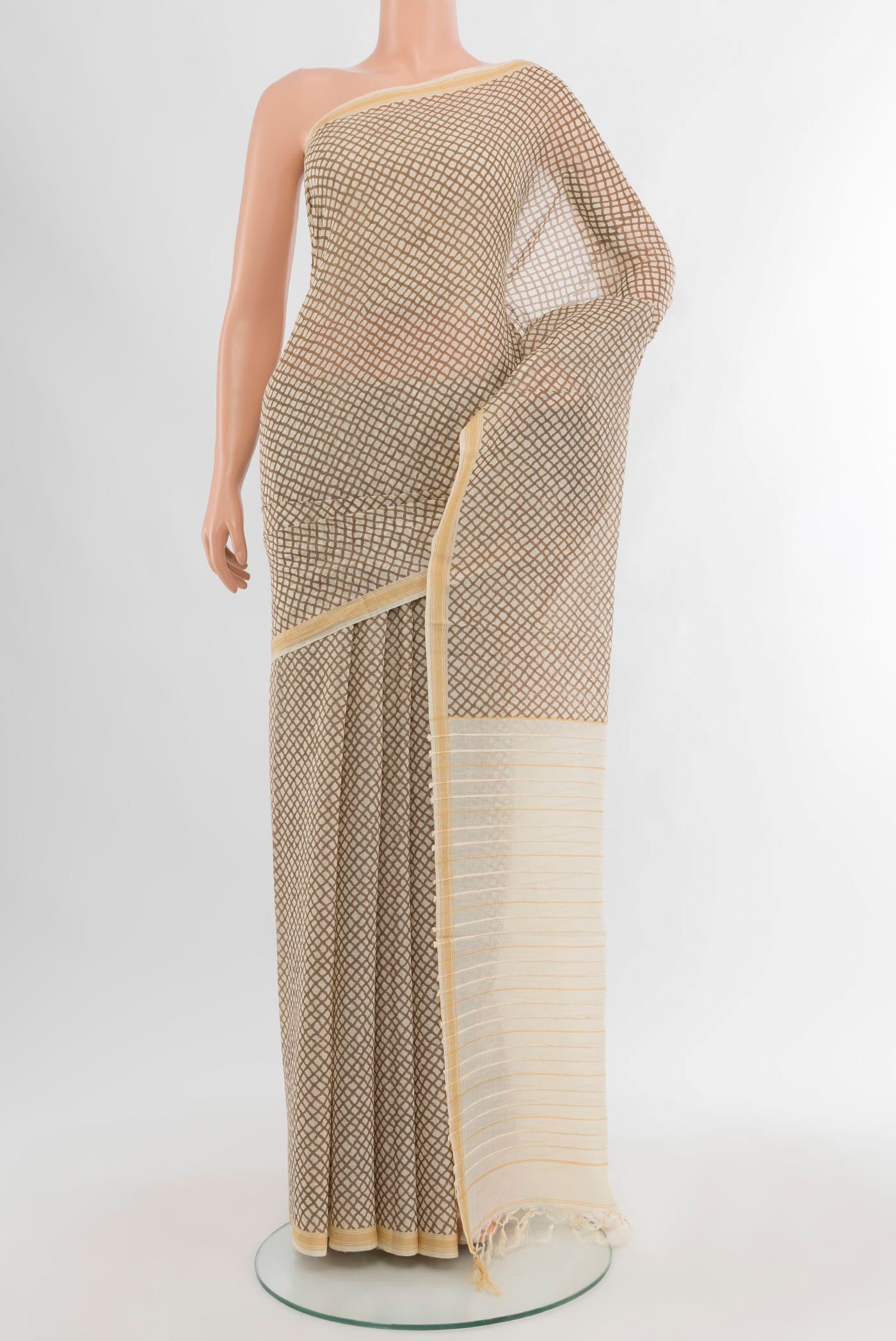 Cream Tussar Silk Saree with Floral Print on the body and Plain Border.  displayed on a mannequin
