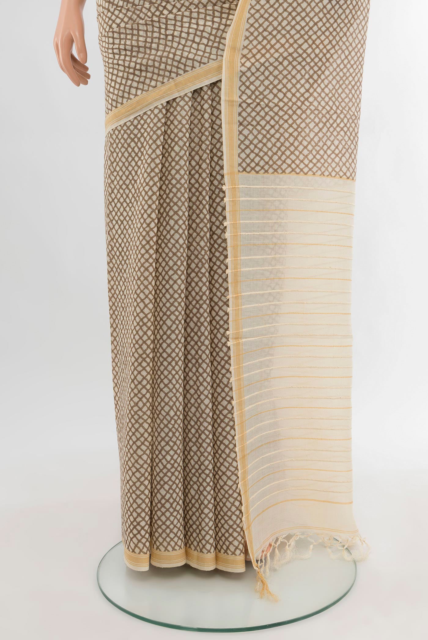Pleats and pallu of Cream Tussar Silk Saree with Floral Print on the body and Plain Border. 