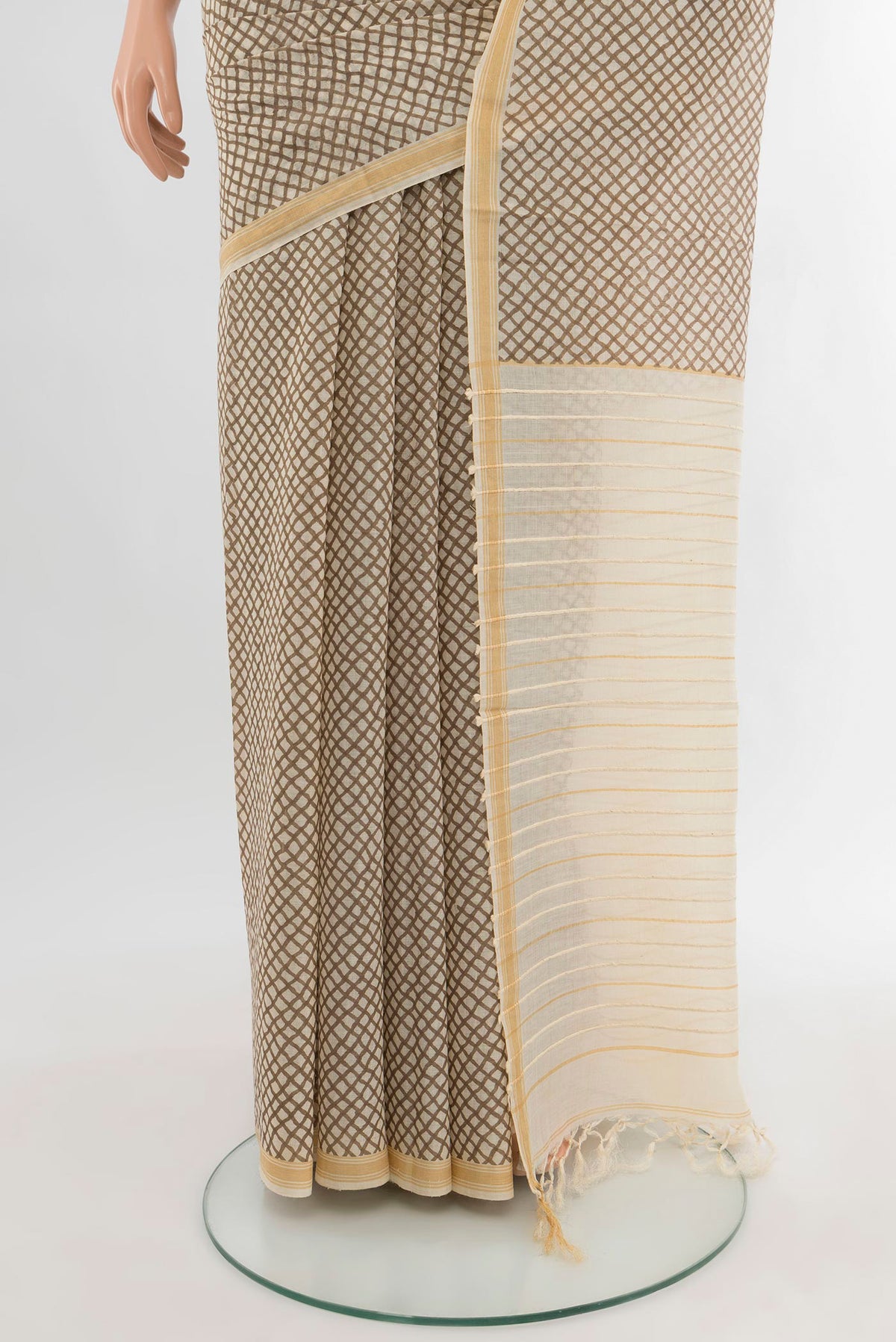 Pleats and pallu of Cream Tussar Silk Saree with Floral Print on the body and Plain Border. 