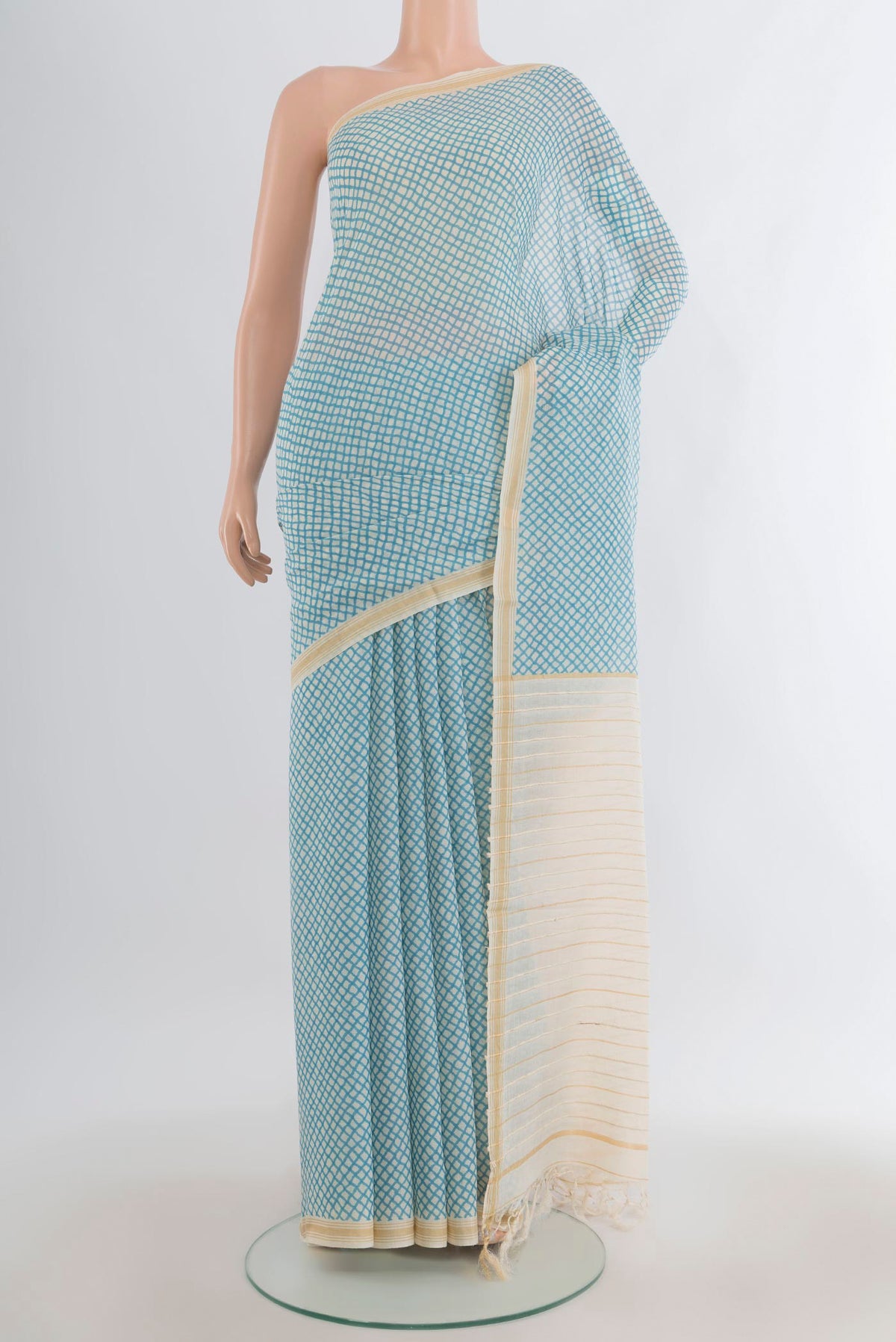 Blue Tussar Saree with Printed design on the body and Plain Border.  displayed on a mannequin