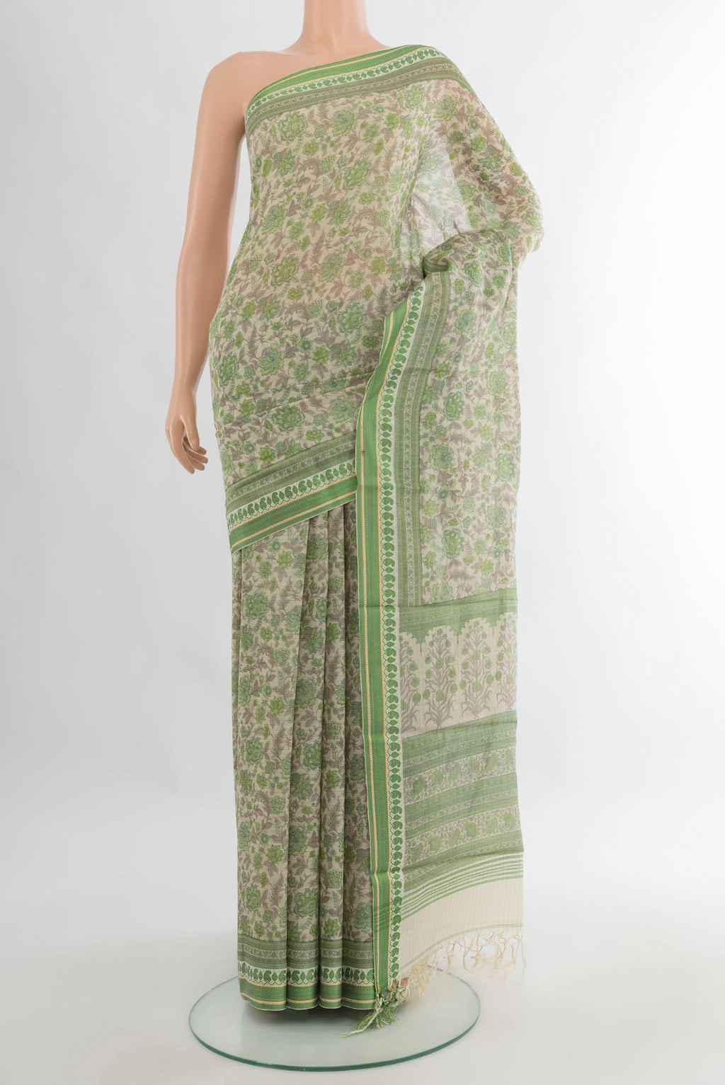 Cream Tussar Saree with Floral Print on the body and Thread Border.  displayed on a mannequin