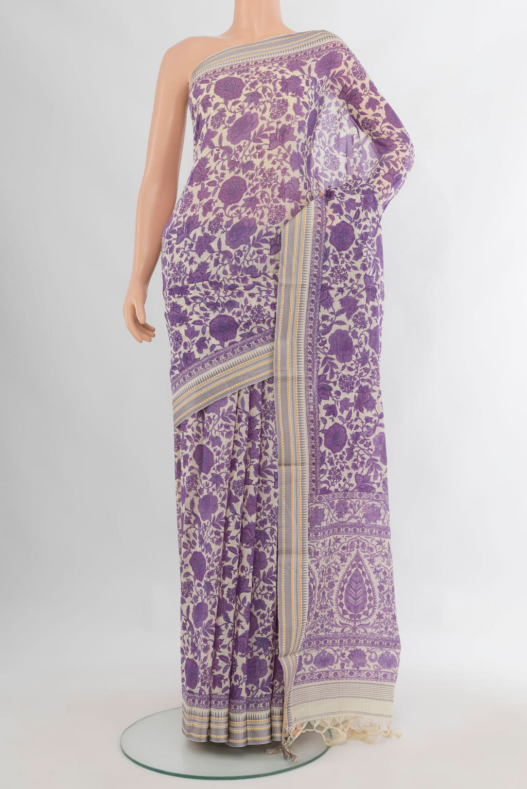 Purple Tussar Saree with Floral Print on the body and Thread Border.  displayed on a mannequin