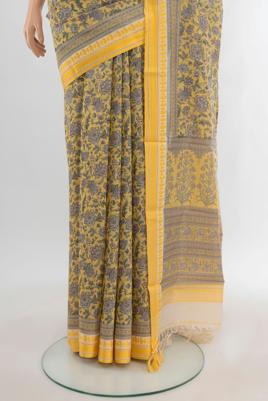 Pleats and pallu of Yellow Tussar Silk Saree with Floral Print on the body and Thread Border. 