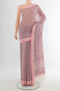 Rose Gold Tussar Saree with Floral Print on the body and Thread Border.  displayed on a mannequin